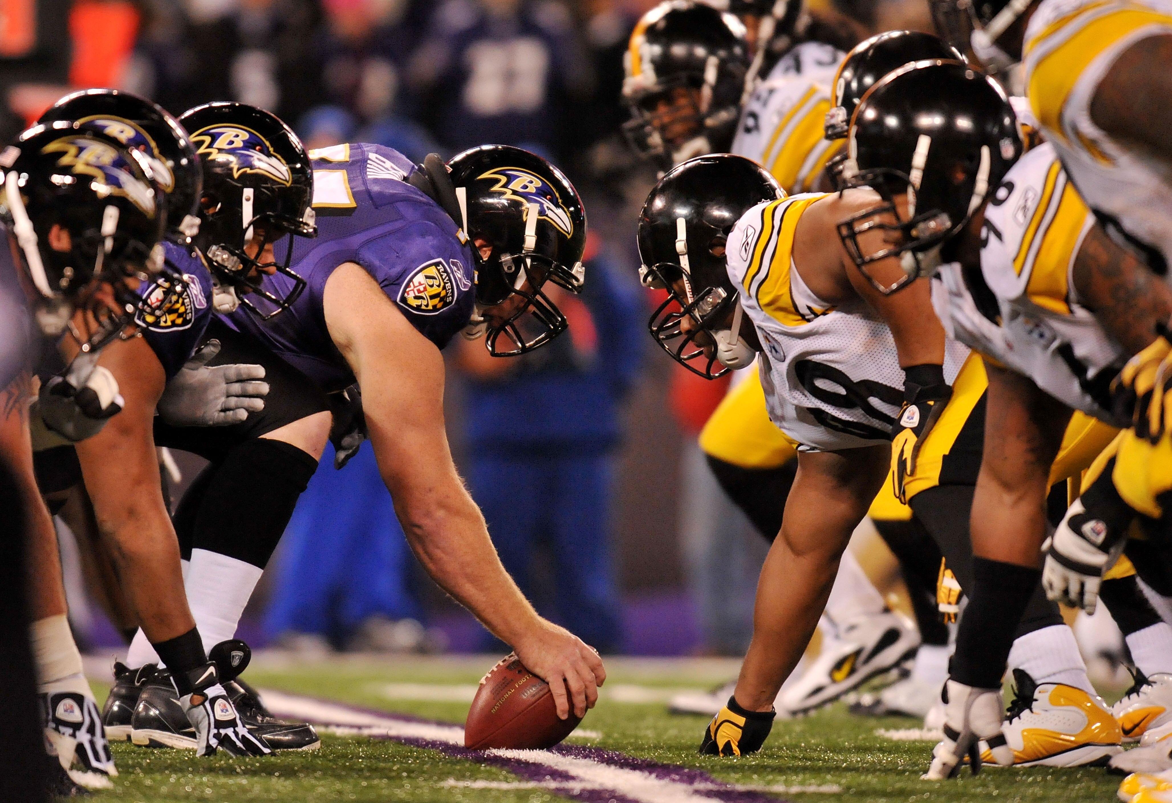 BALTIMORE, MD - DECEMBER 05:  Matt Birk #77 of the Baltimore Ravens prepares to snap the ball against the Pittsburgh Steelers at M&T Bank Stadium on December 5, 2010 in Baltimore, Maryland. Pittsburgh won 13-10.  (Photo by Larry French/Getty Images)