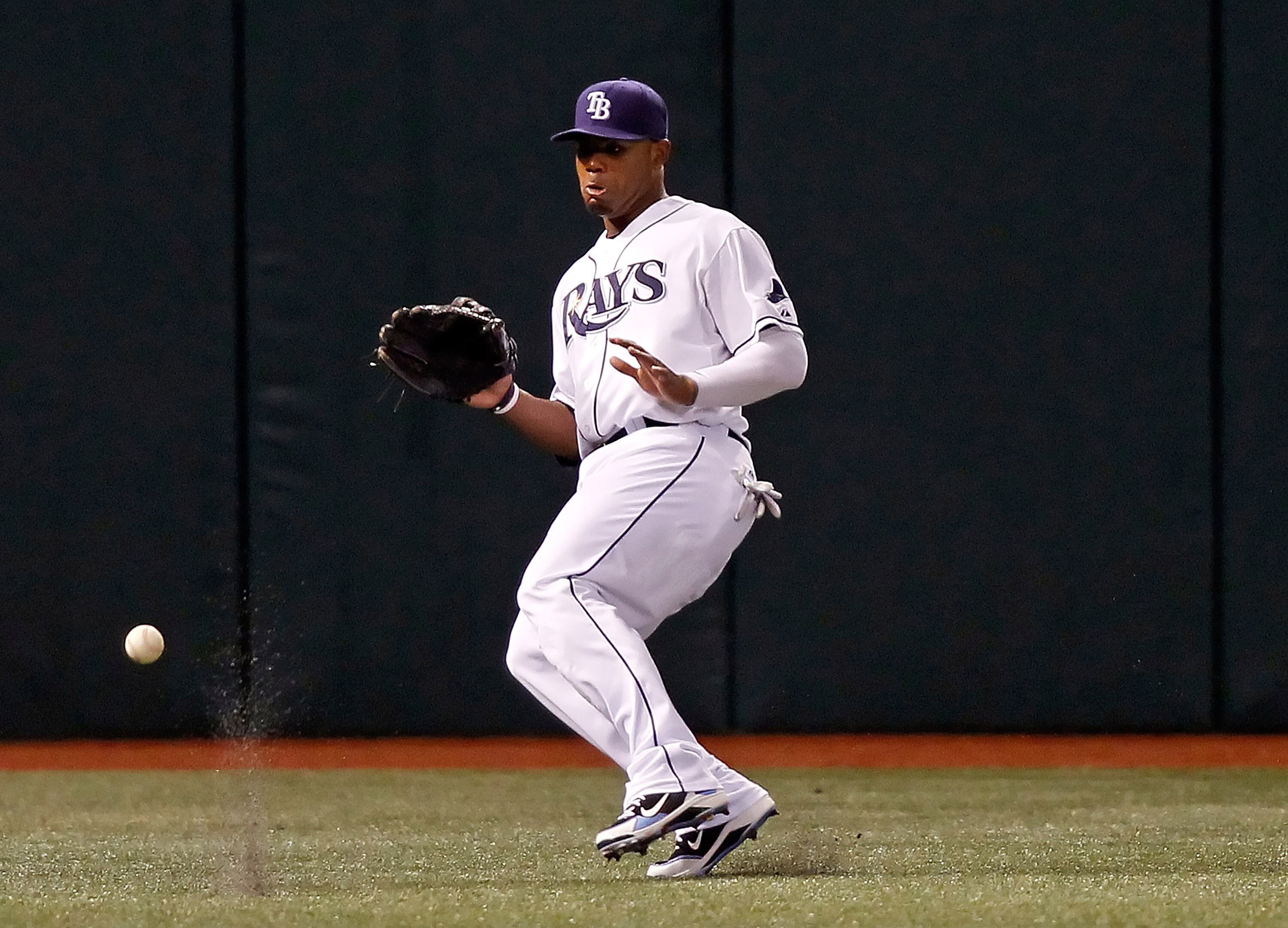 ST. PETERSBURG, FL - SEPTEMBER 15:  Outfielder Carl Crawford #13 of the Tampa Bay Rays cannot get to this fly ball against the New York Yankees during the game at Tropicana Field on September 15, 2010 in St. Petersburg, Florida.  (Photo by J. Meric/Getty