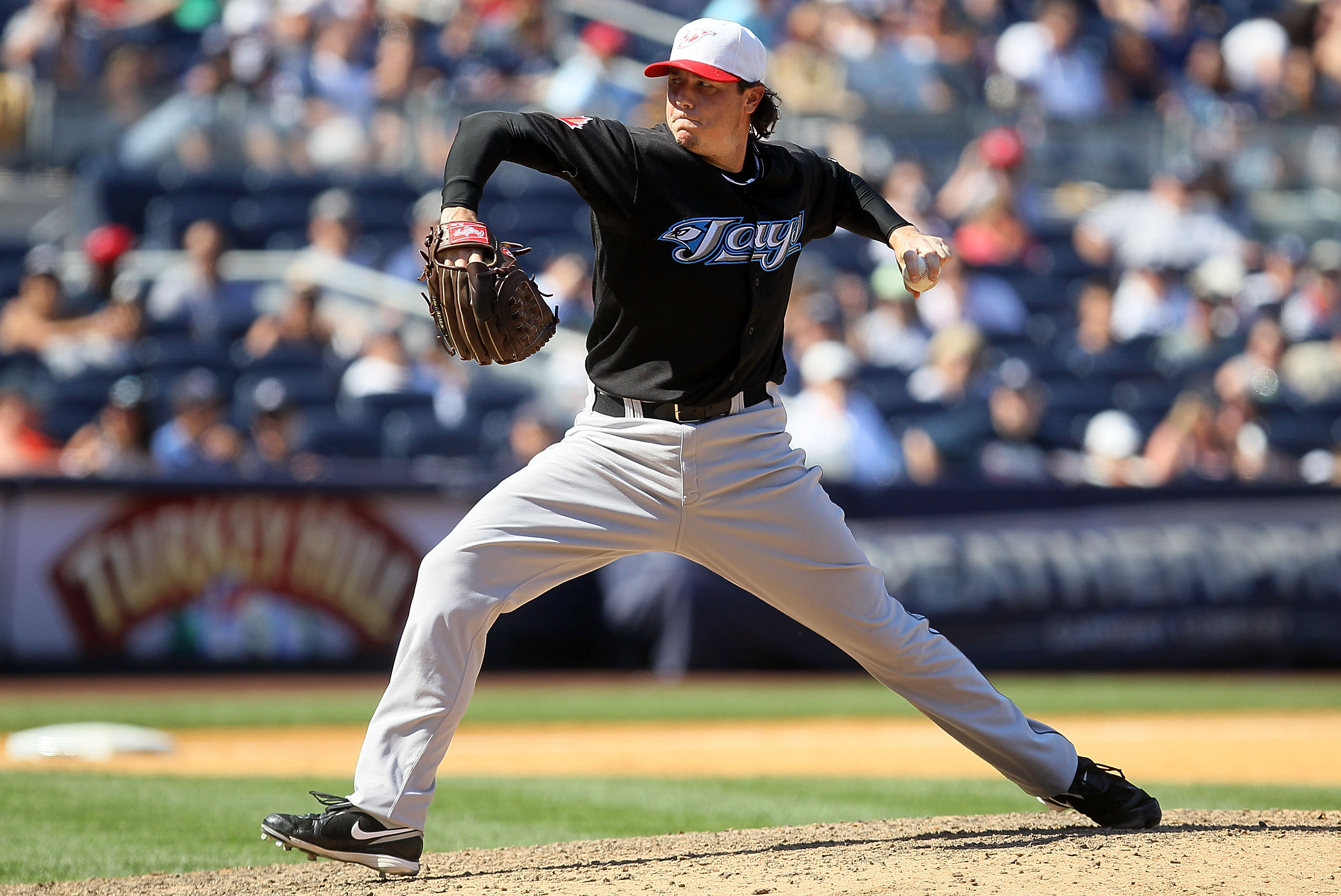 NEW YORK - JULY 04:  Scott Downs #37 of the Toronto Blue Jays delivers a pitch against the New York Yankees on July 4, 2010 at Yankee Stadium in the Bronx borough of New York City.  (Photo by Jim McIsaac/Getty Images)