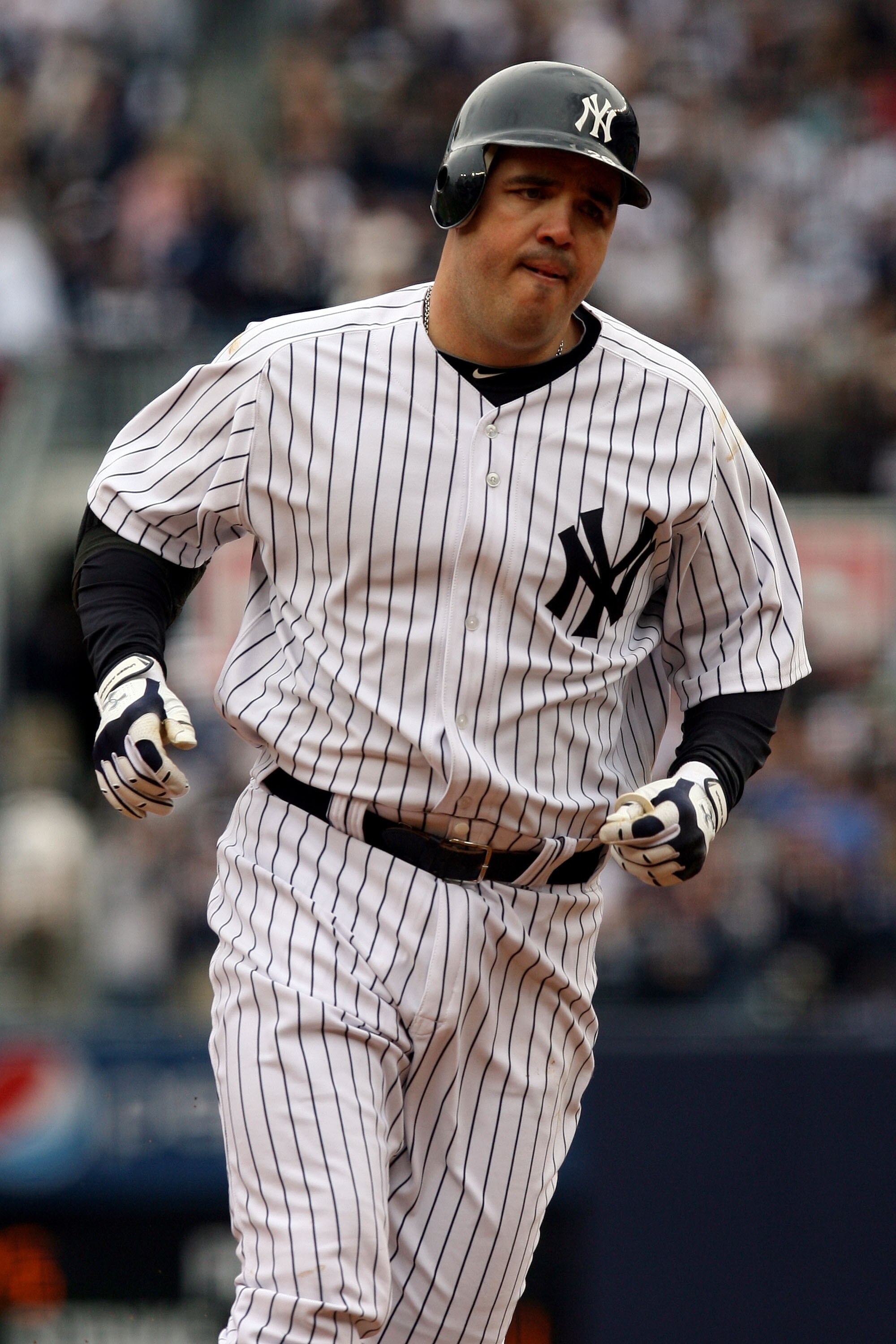 NEW YORK - APRIL 13:  Nick Johnson #26 of the New York Yankees rounds the bases after hitting a solo home run in the bottom of the first inning against the Los Angeles Angels of Anaheim during the Yankees home opener at Yankee Stadium on April 13, 2010 in