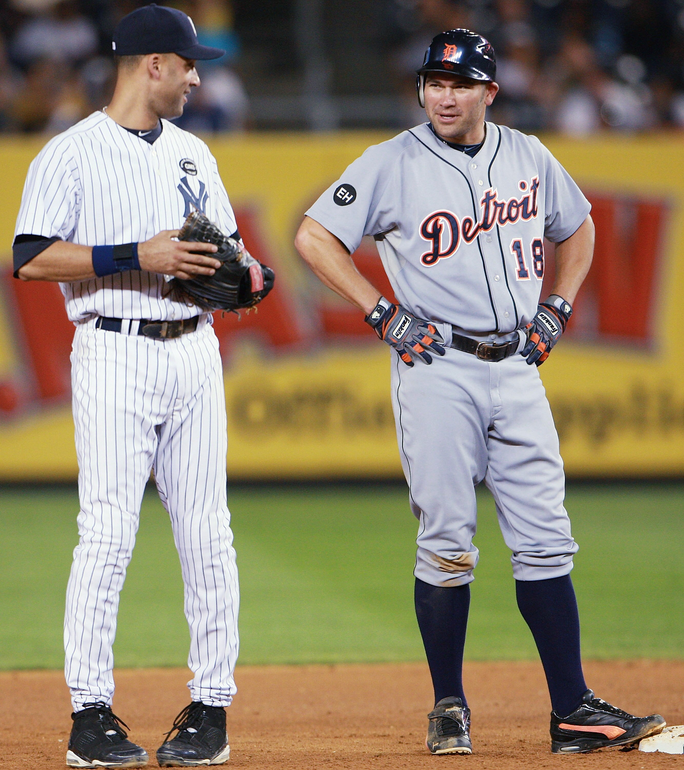 NEW YORK - AUGUST 18:  Johnny Damon #18 of the Detroit Tigers talks with Derek Jeter #2 of the New York Yankees during a game at Yankee Stadium on August 18, 2010 in the Bronx borough of New York City.  The Yankees won 9 - 5. (Photo by Andrew Burton/Getty