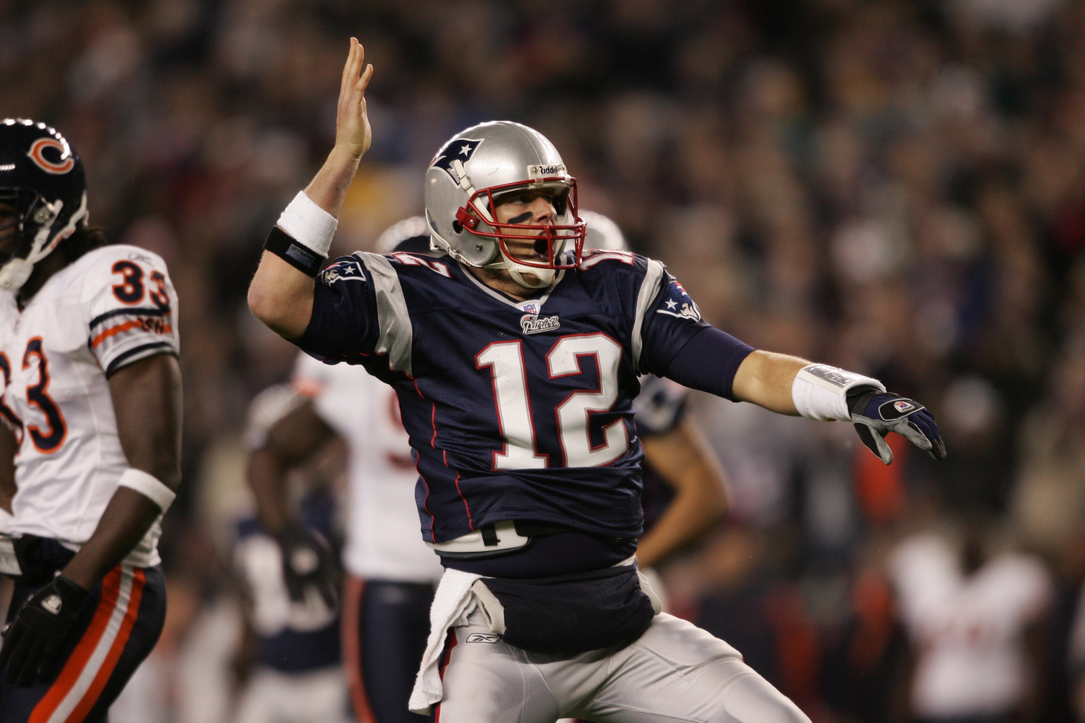 FOXBOROUGH, MA - NOVEMBER 26:  Quarterback Tom Brady #12 of the New England Patriots signals first down against the Chicago Bears on November 26, 2006 at Gillette Stadium in Foxborough, Massachusetts. The Patriots defeated the Bears 17-13. (Photo by Elsa/