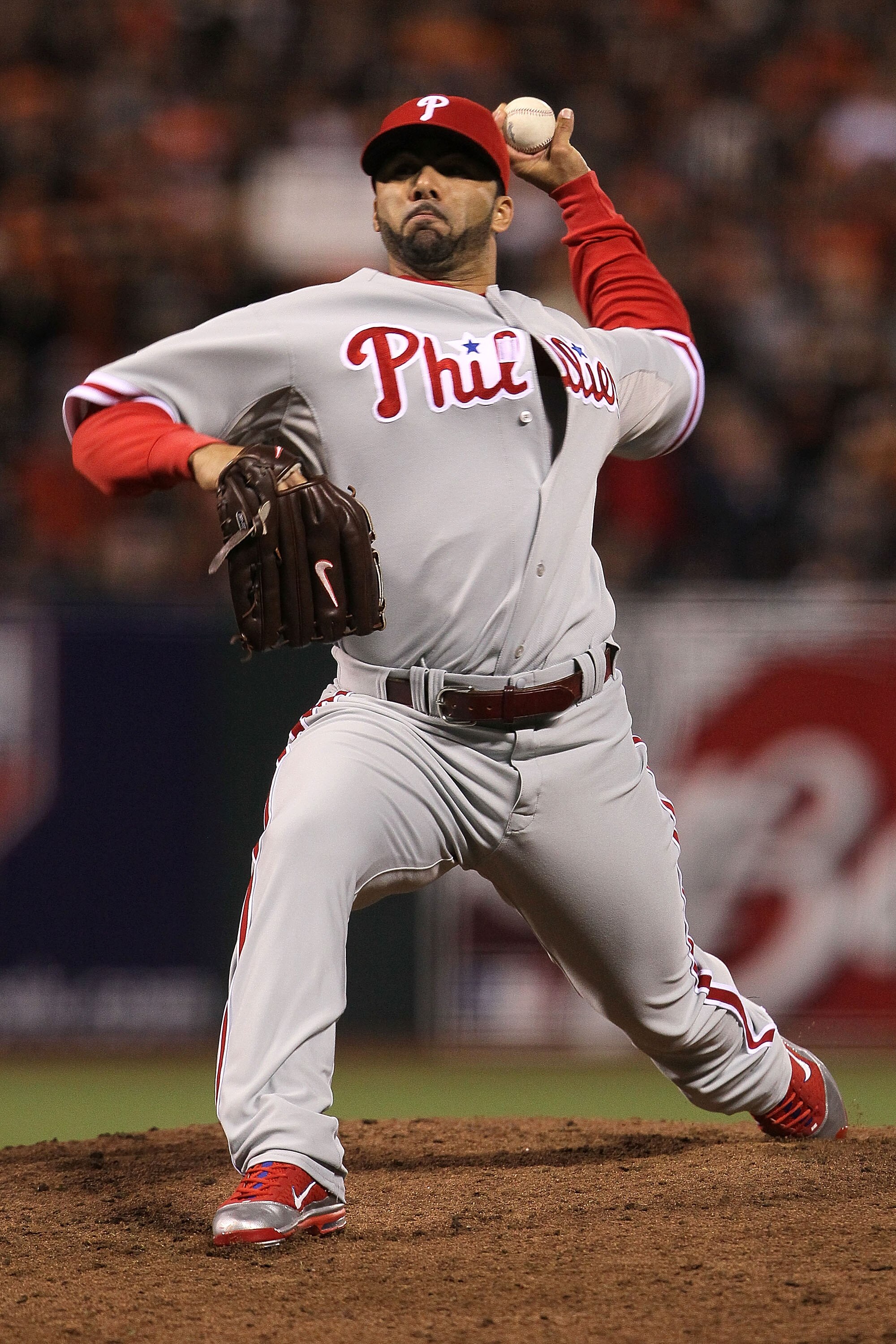 SAN FRANCISCO - OCTOBER 21:  J.C. Romero #16 of the Philadelphia Phillies throws a pitch against the San Francisco Giants in Game Five of the NLCS during the 2010 MLB Playoffs at AT&T Park on October 21, 2010 in San Francisco, California.  (Photo by Justi