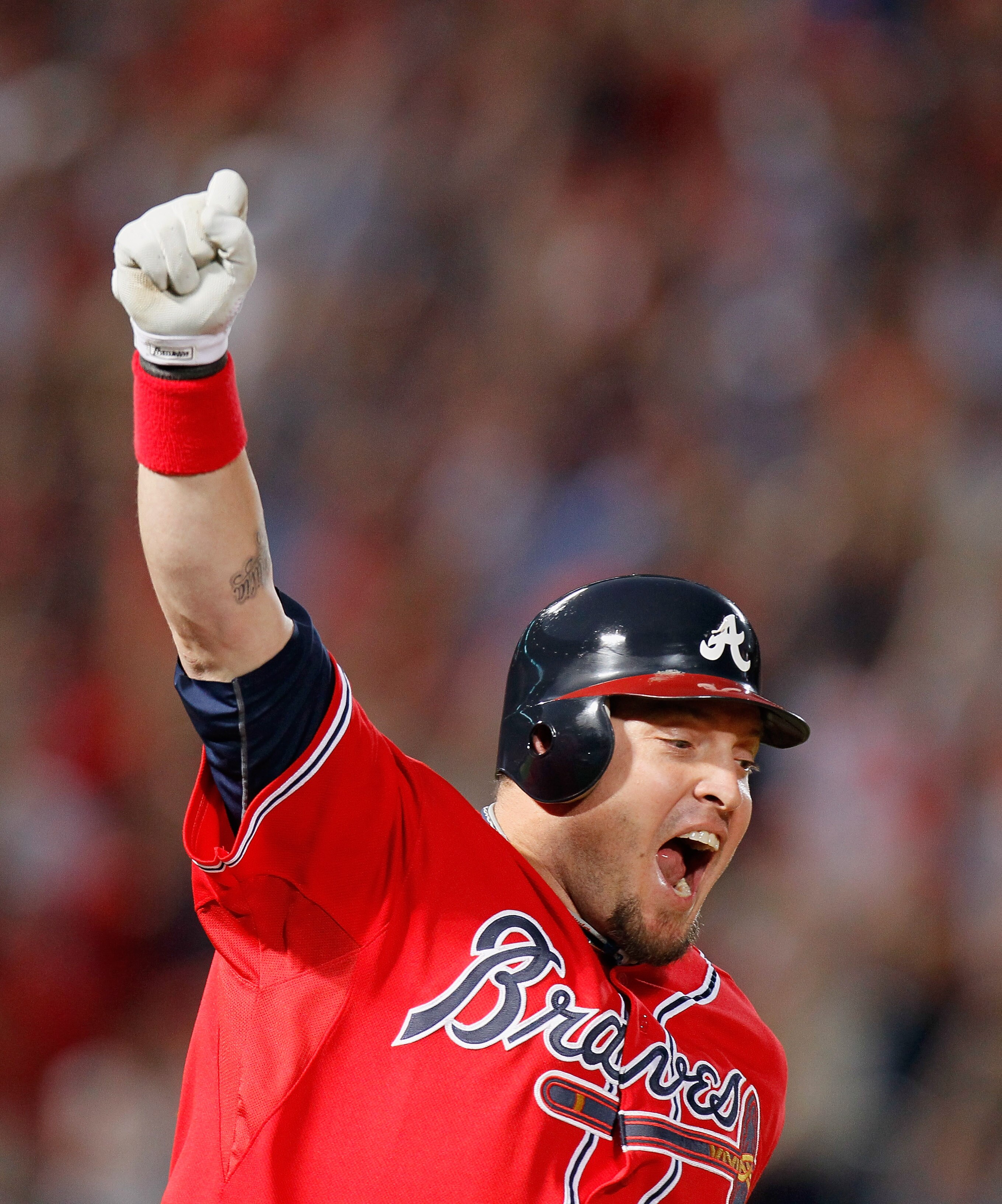 ATLANTA - OCTOBER 10:  Eric Hinske #20 of the Atlanta Braves reacts after hitting a two-run homer in the eighth inning off pitcher Sergio Romo #54 of the San Francisco Giants during Game Three of the NLDS of the 2010 MLB Playoffs at Turner Field on Octobe