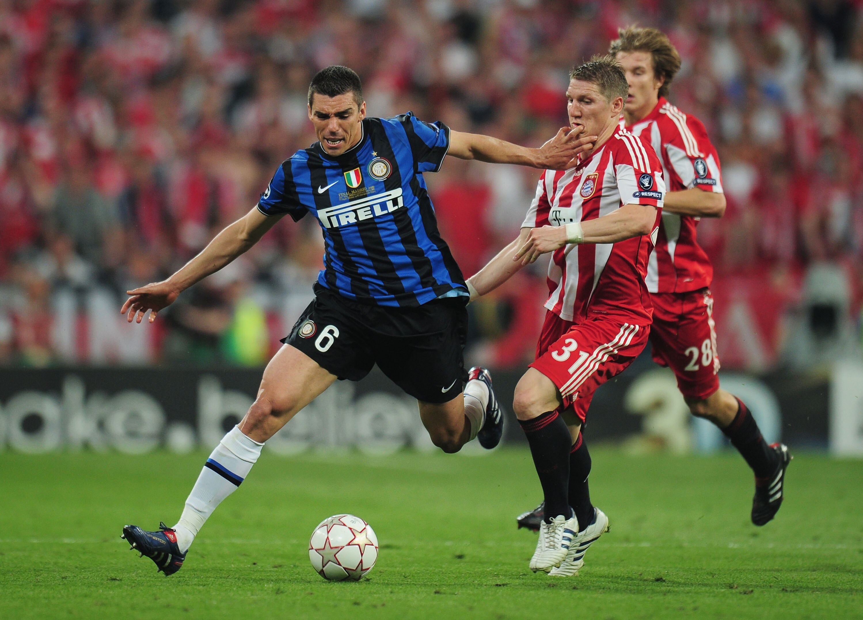 MADRID, SPAIN - MAY 22:  Lucio of Inter Milan is challenged by Bastian Schweinsteiger of Bayern Muenchen during the UEFA Champions League Final match between FC Bayern Muenchen and Inter Milan at the Estadio Santiago Bernabeu on May 22, 2010 in Madrid, Sp