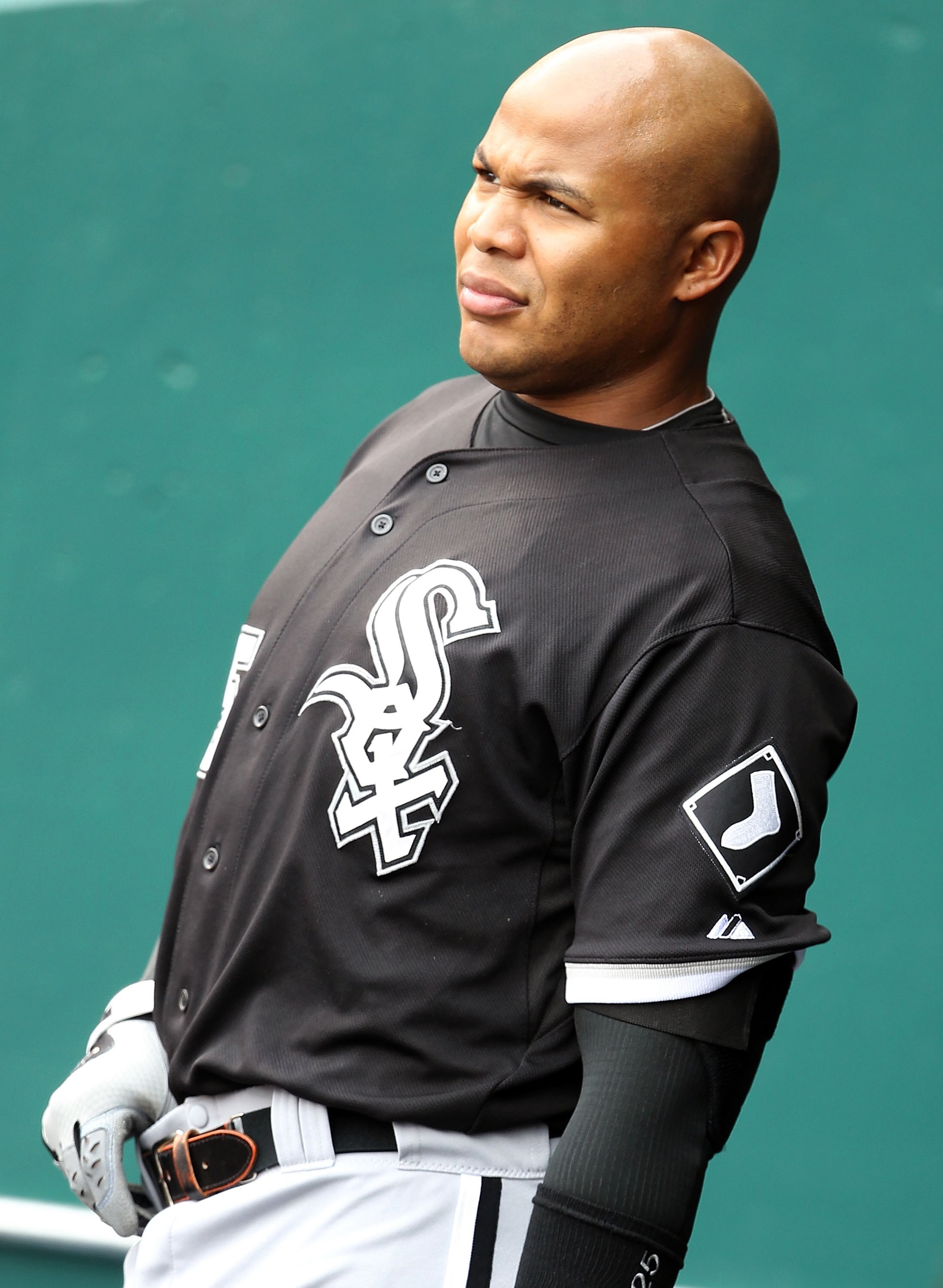 KANSAS CITY, MO - MAY 16:  Andruw Jones #25 of the Chicago White Sox talks to players in the dugout prior to the start of the game against the Kansas City Royals on May 16, 2010 at Kauffman Stadium in Kansas City, Missouri.  (Photo by Jamie Squire/Getty I