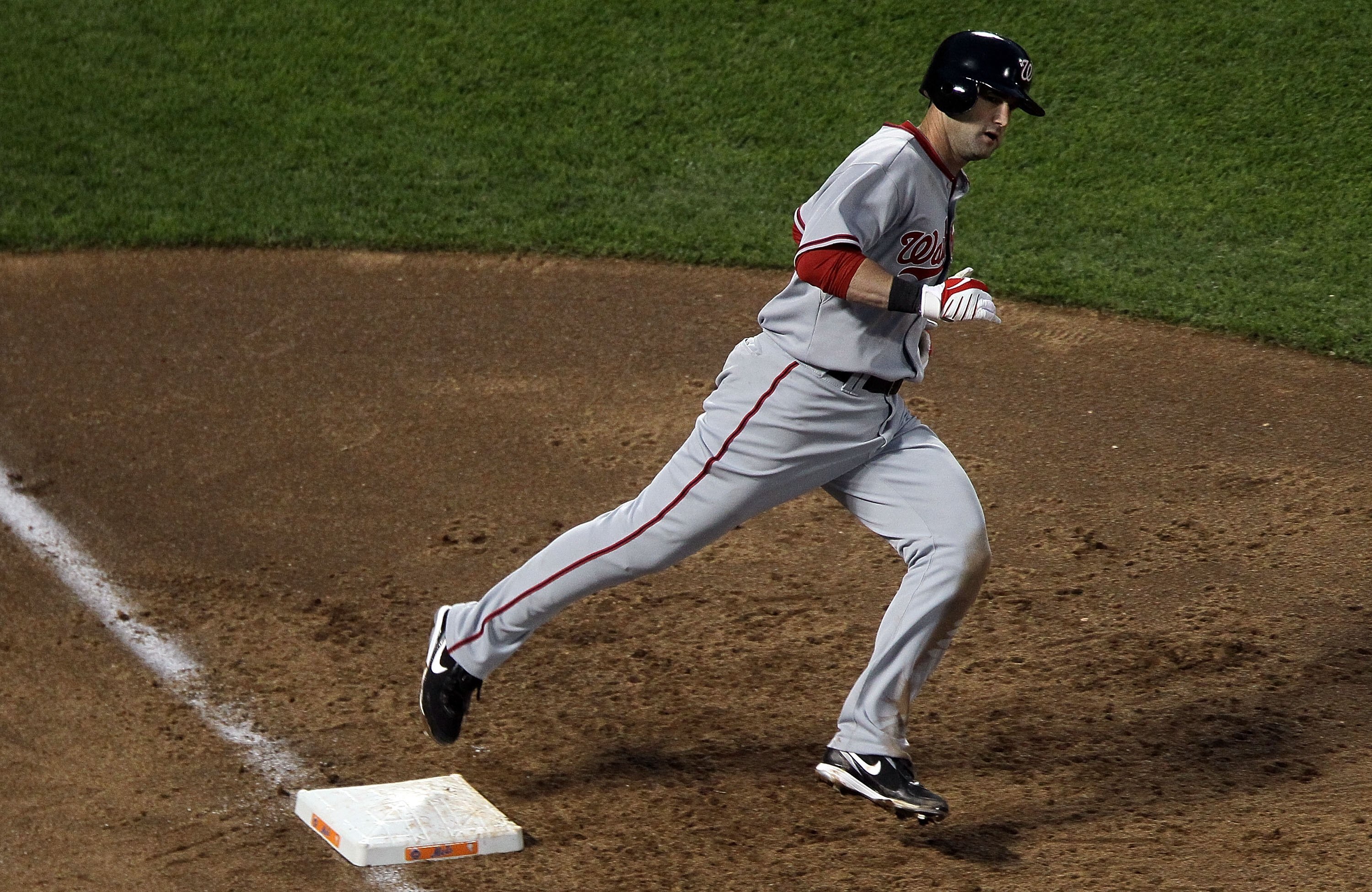 NEW YORK - MAY 10:  Adam Kennedy #20 of the Washington Nationals runs the bases as he watches his third inning home run against the New York Mets land in the right field seats on May 10, 2010 at Citi Field in the Flushing neighborhood of the Queens boroug