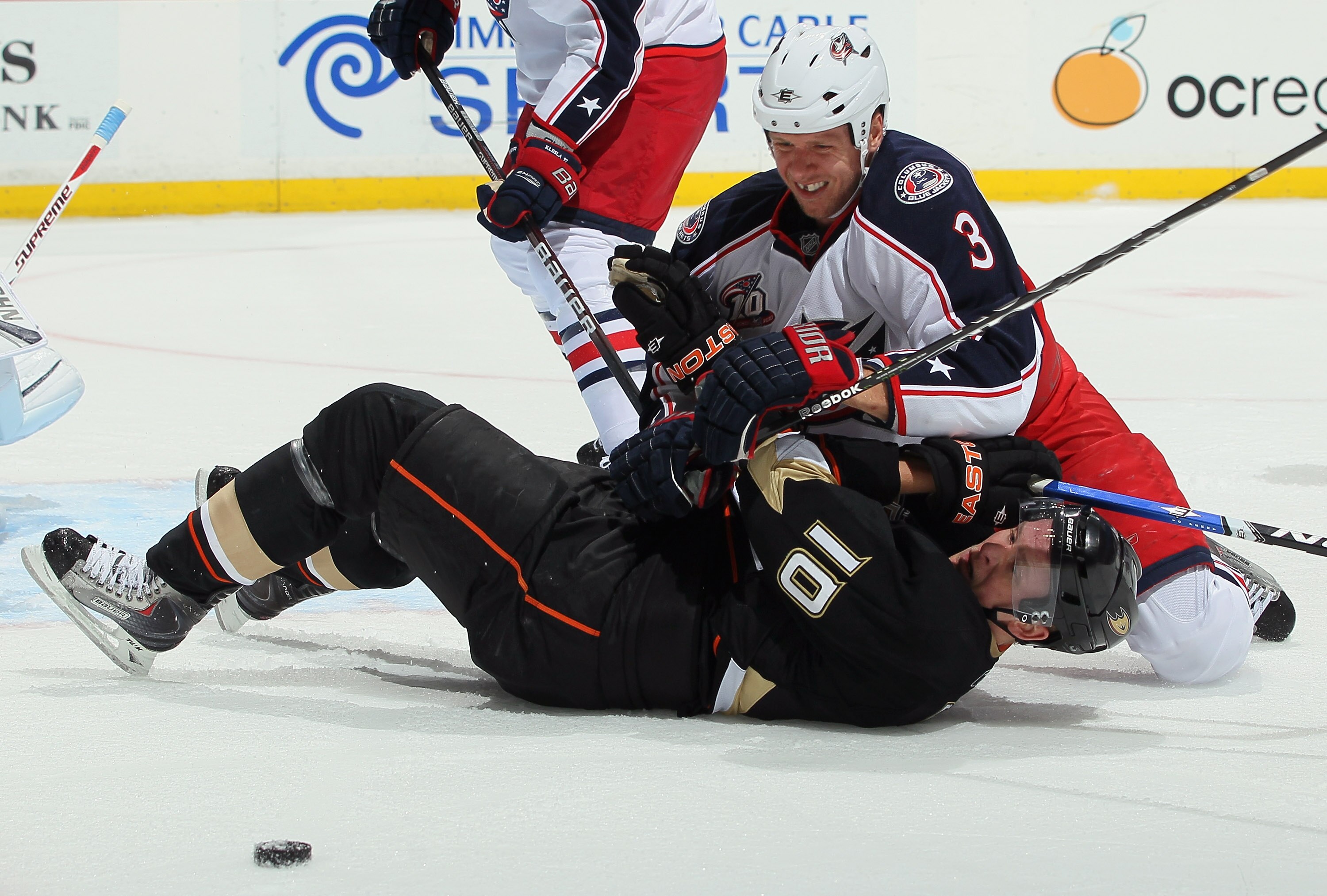 ANAHEIM, CA - NOVEMBER 19:  Marc Methot #3 of the Columbus Blue Jackets and Corey Perry #10 of the Anaheim Ducks get tangled up during the first period at the Honda Center on November 19, 2010 in Anaheim, California.  (Photo by Jeff Gross/Getty Images)