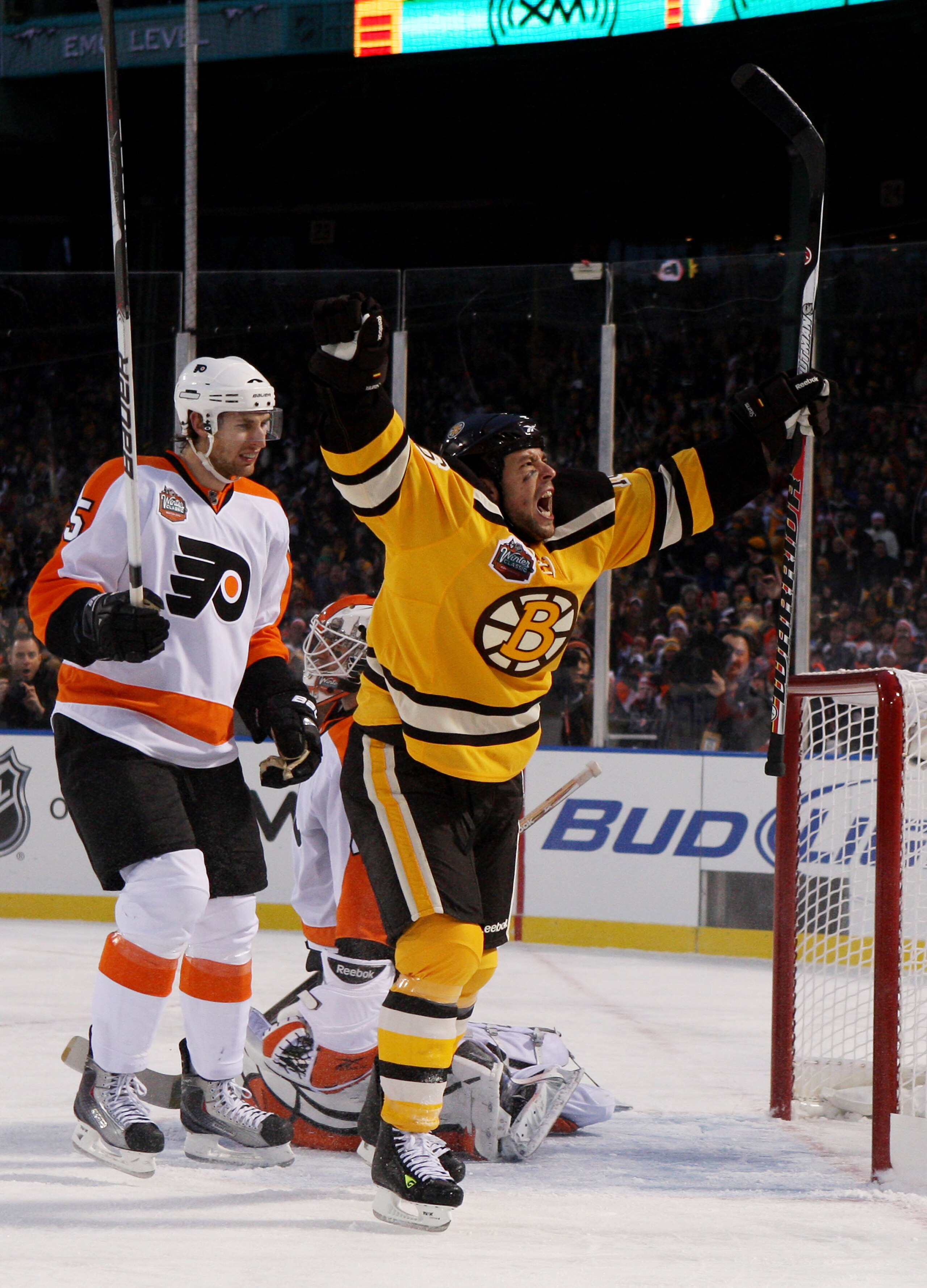 BOSTON - JANUARY 01:  Marco Sturm #16 of the Boston Bruins celebrates scoring a goal to defeat the Philadelphia Flyers 2-1 in overtime during the 2010 Bridgestone Winter Classic at Fenway Park on January 1, 2010 in Boston, Massachusetts.  (Photo by Jim Mc