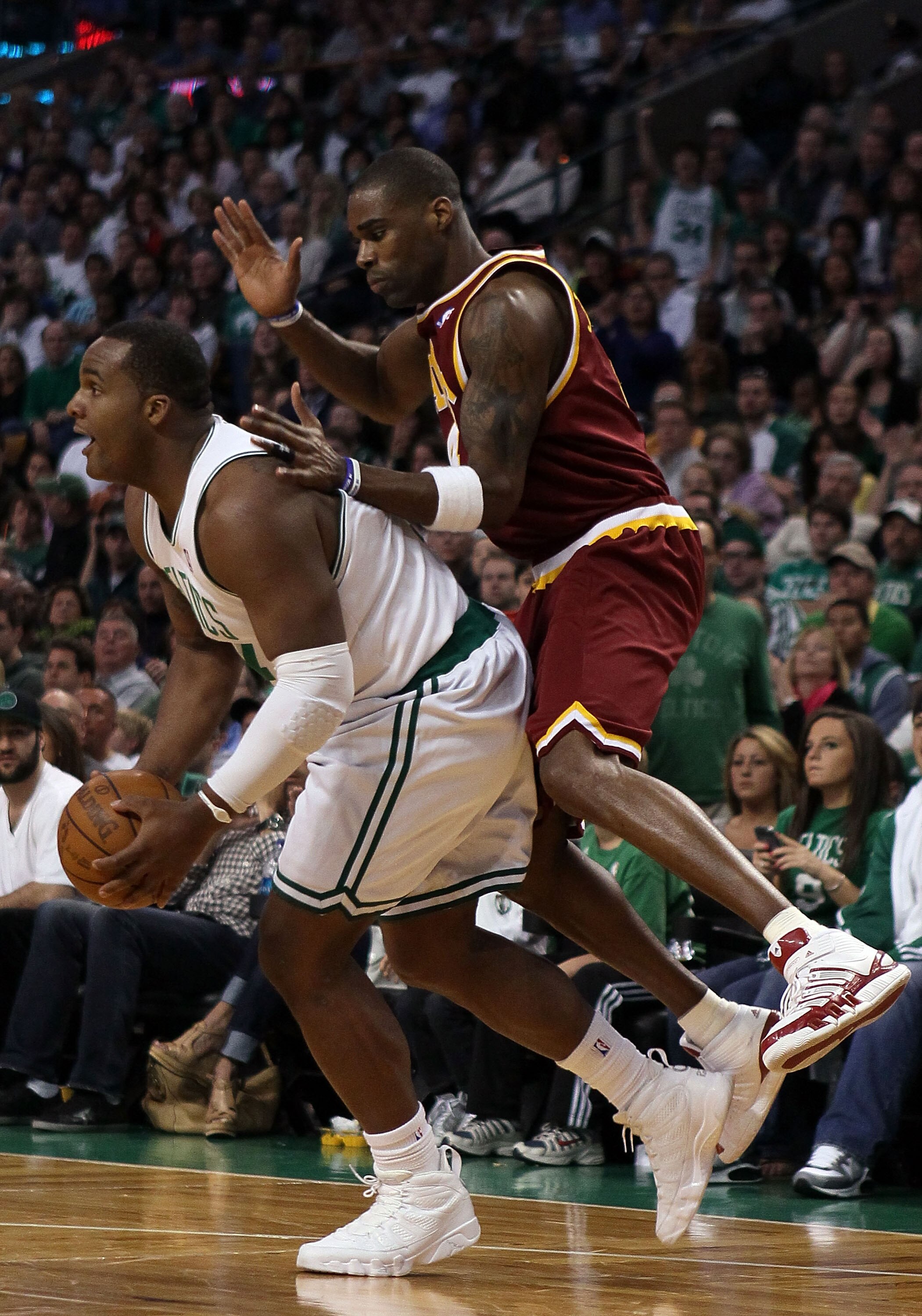 BOSTON - MAY 09:   Glen Davis #11 of the Boston Celtics grabs the ball as Antawn Jamison #4 of the Cleveland Cavaliers defends during Game Four of the Eastern Conference Semifinals of the 2010 NBA playoffs at TD Garden on May 9, 2010 in Boston, Massachuse