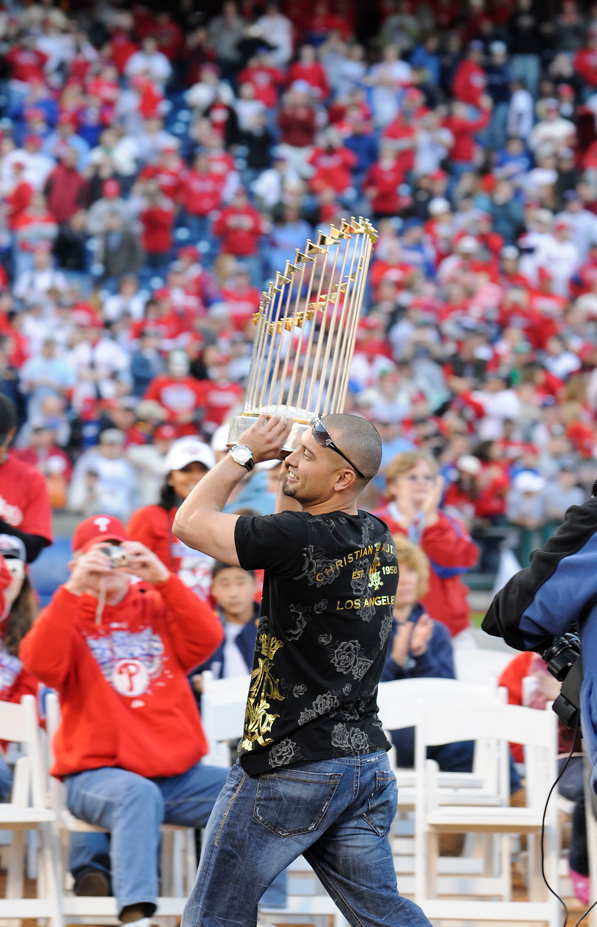 PHILADELPHIA, PA - OCTOBER 31: Philadelphia Phillies Shane Victorino carries the World Series Trophy at a victory rally at Citizens Bank Park October 31, 2008 in Philadelphia, Pennsylvania. The Phillies defeated the Tampa Bay  Rays to win their first Worl