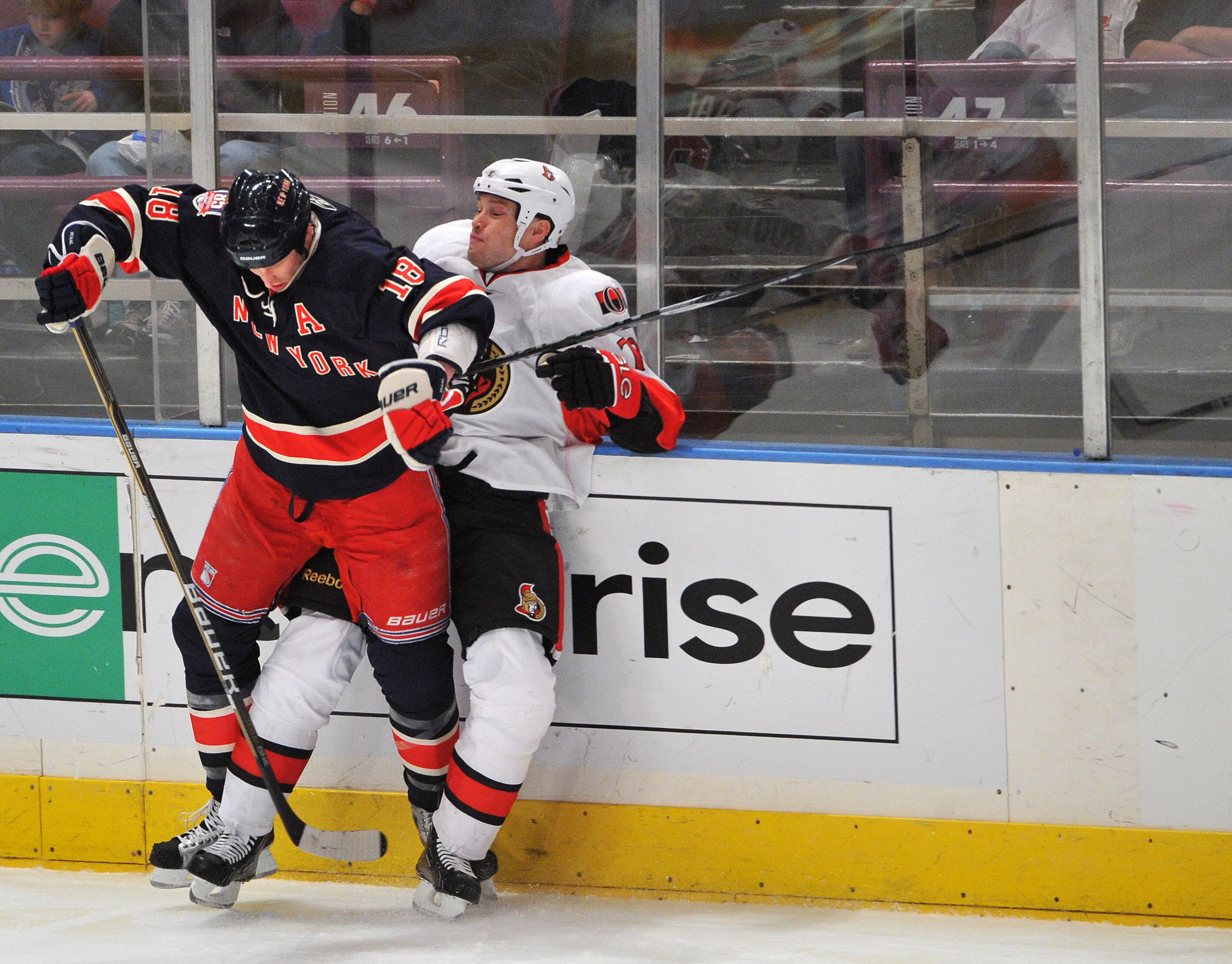 NEW YORK, NY - DECEMBER 5: Marc Staal #18 of the New York Rangers checks Jarkko Ruutu #73 of the Ottawa Senators during the third period at Madison Square Garden on December 5, 2010 in New York City. (Photo by Christopher Pasatieri/Getty Images)