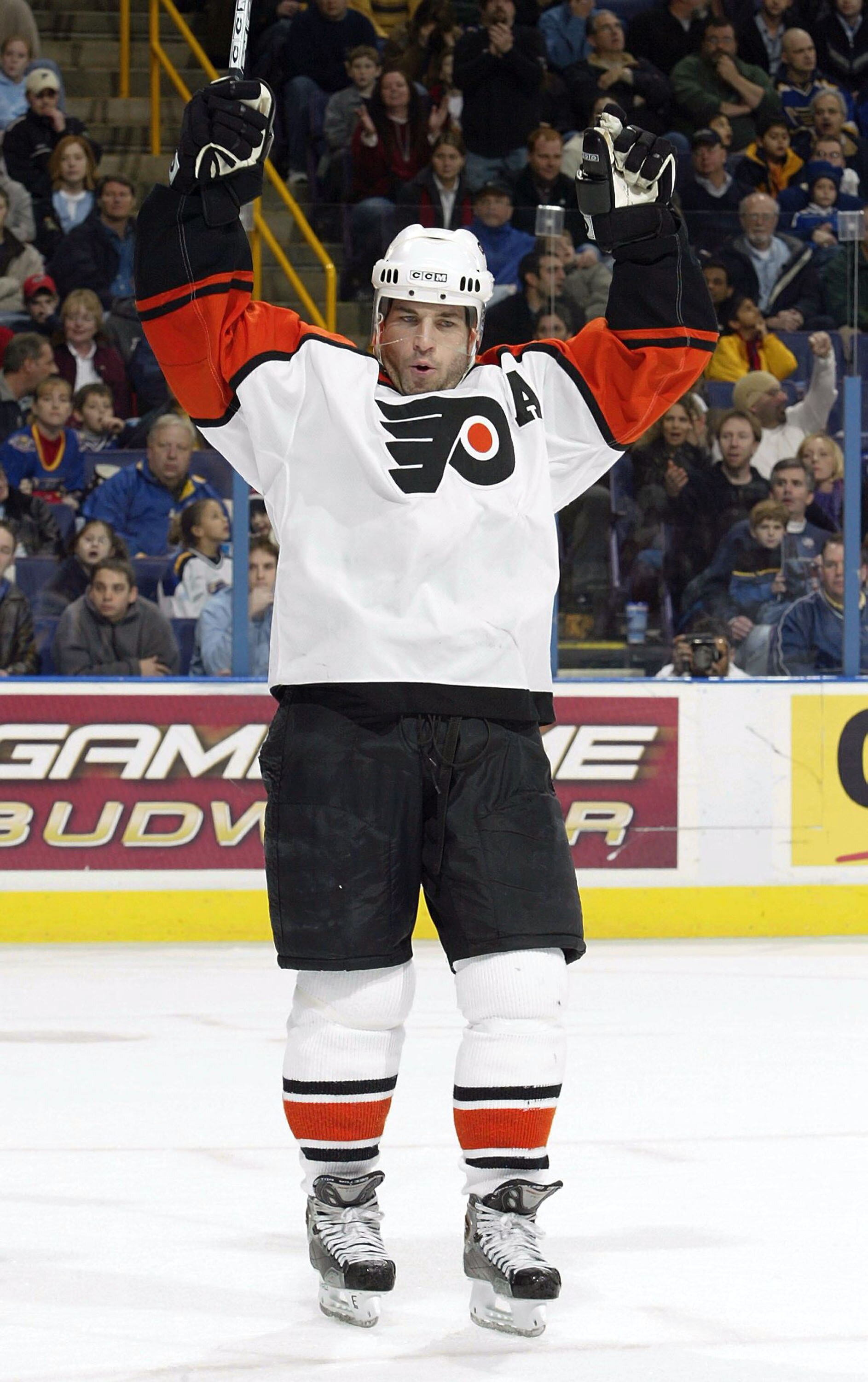ST. LOUIS - DECEMBER 30:  Mark Recchi #8 of the Philadelphia Flyers celebrates his goal in the second period against the St. Louis Blues on December 30, 2003 at the Savvis Center in St. Louis, Missouri.  (Photo by Elsa/Getty Images)