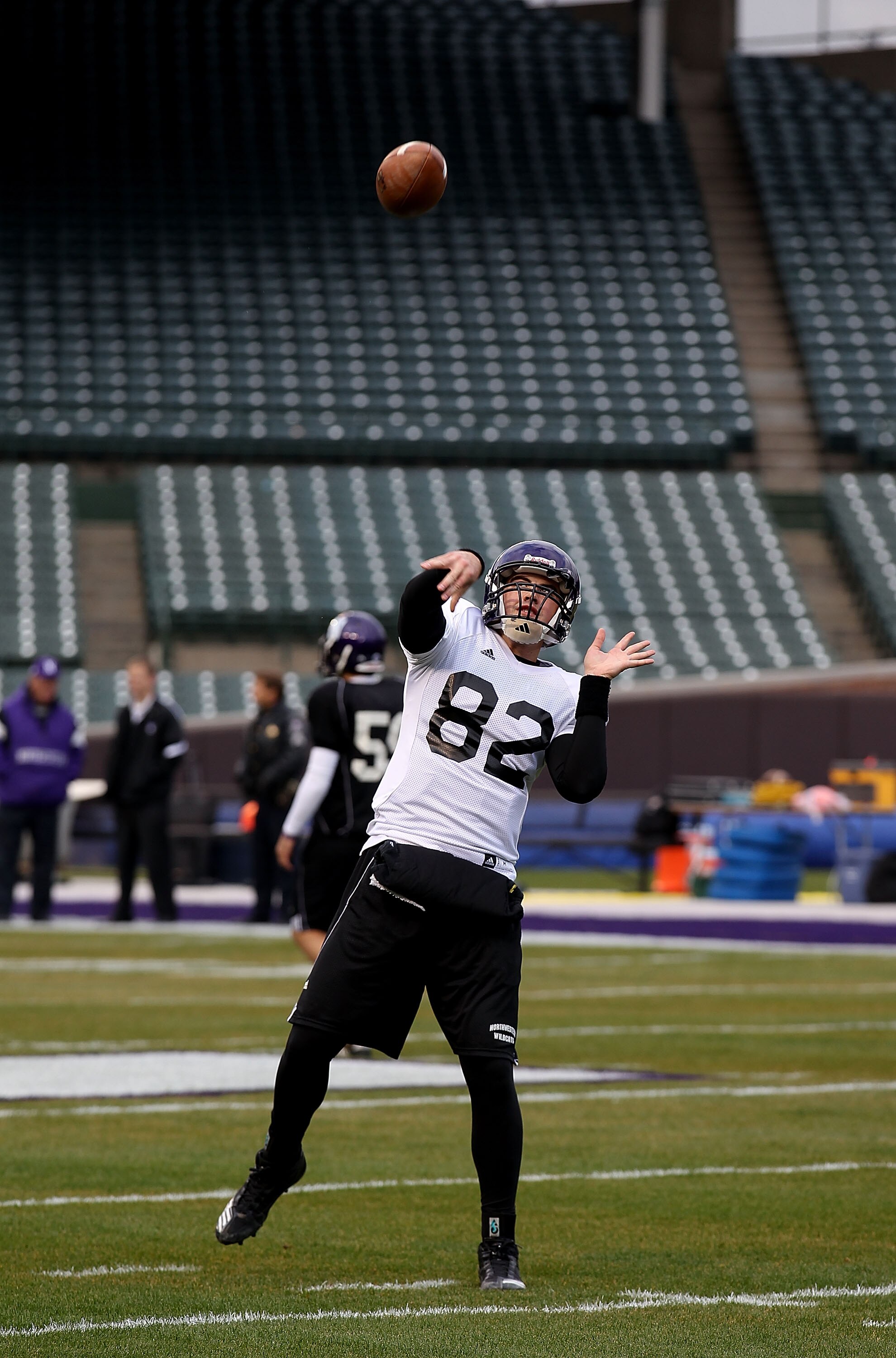 CHICAGO - NOVEMBER 18: Evan Watkins #82 of Northwestern Wildcats, who will start at quarterback, throws a pass during practice for a game against the Illinois Fighting Illini on Saturday November 20 at Wrigley Field on November 18, 2010 in Chicago, Illino