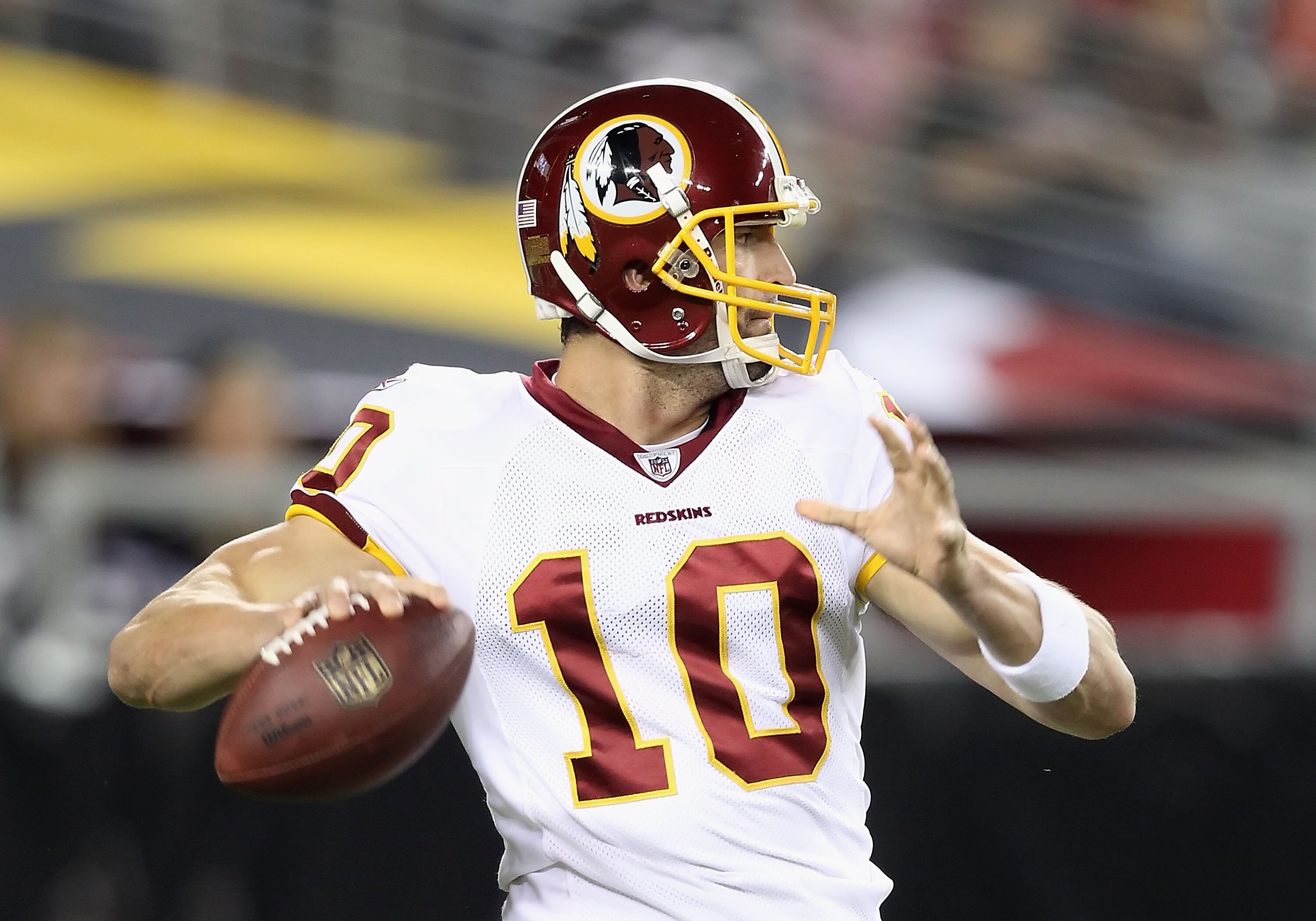 GLENDALE, AZ - SEPTEMBER 02:  Quarterback Richard Bartel #10 of the Washington Redskins drops back to pass during the preseason NFL game against the Arizona Cardinals at the University of Phoenix Stadium on September 2, 2010 in Glendale, Arizona.  The Car