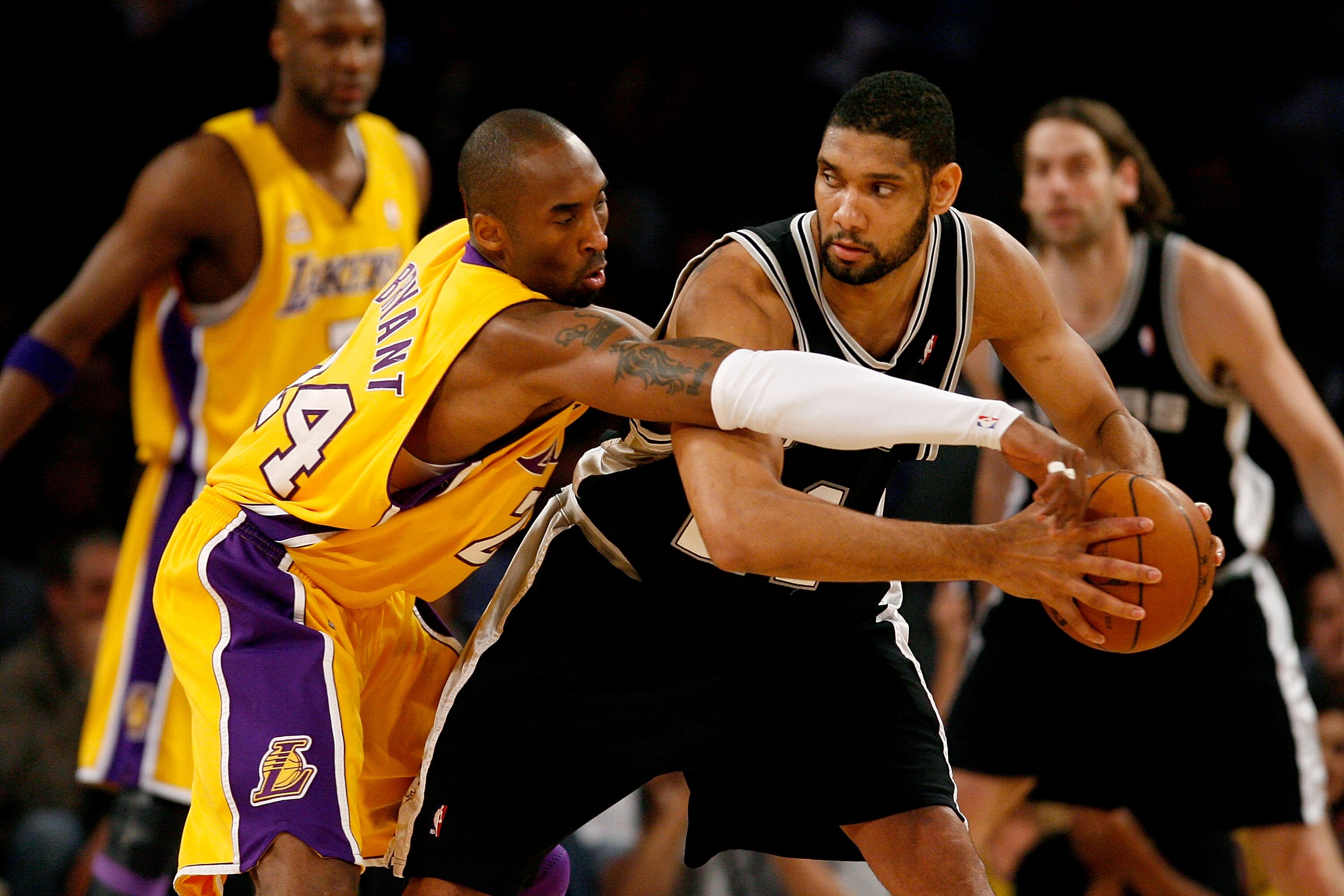 LOS ANGELES, CA - MAY 23:  Kobe Bryant #24 of the Los Angeles Lakers reaches in on Tim Duncan #21 of the San Antonio Spurs in Game Two of the Western Conference Finals during the 2008 NBA Playoffs on May 23, 2008 at Staples Center in Los Angeles, Californ