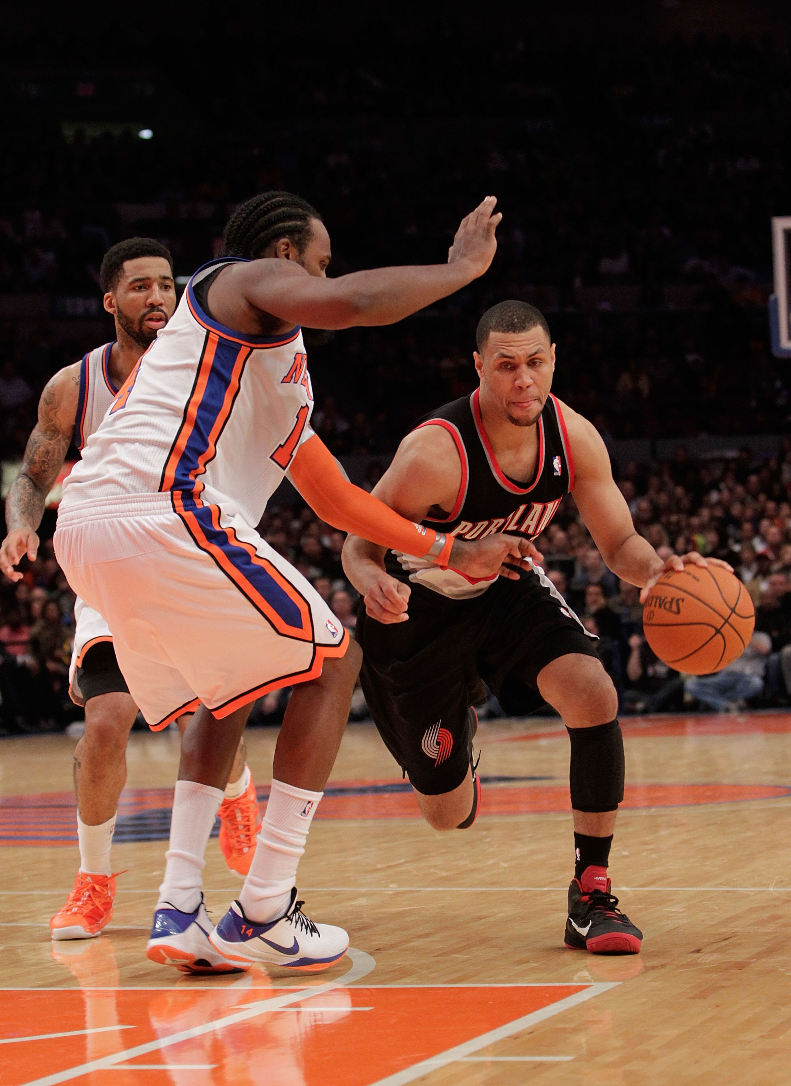 NEW YORK - OCTOBER 30:  Brandon Roy #7 of the Portland Trail Blazer drives the ball past Ronny Turiaf #14 of the New York Knicks at Madison Square Garden on October 30, 2010 in New York City. NOTE TO USER: User expressly acknowledges and agrees that, by d