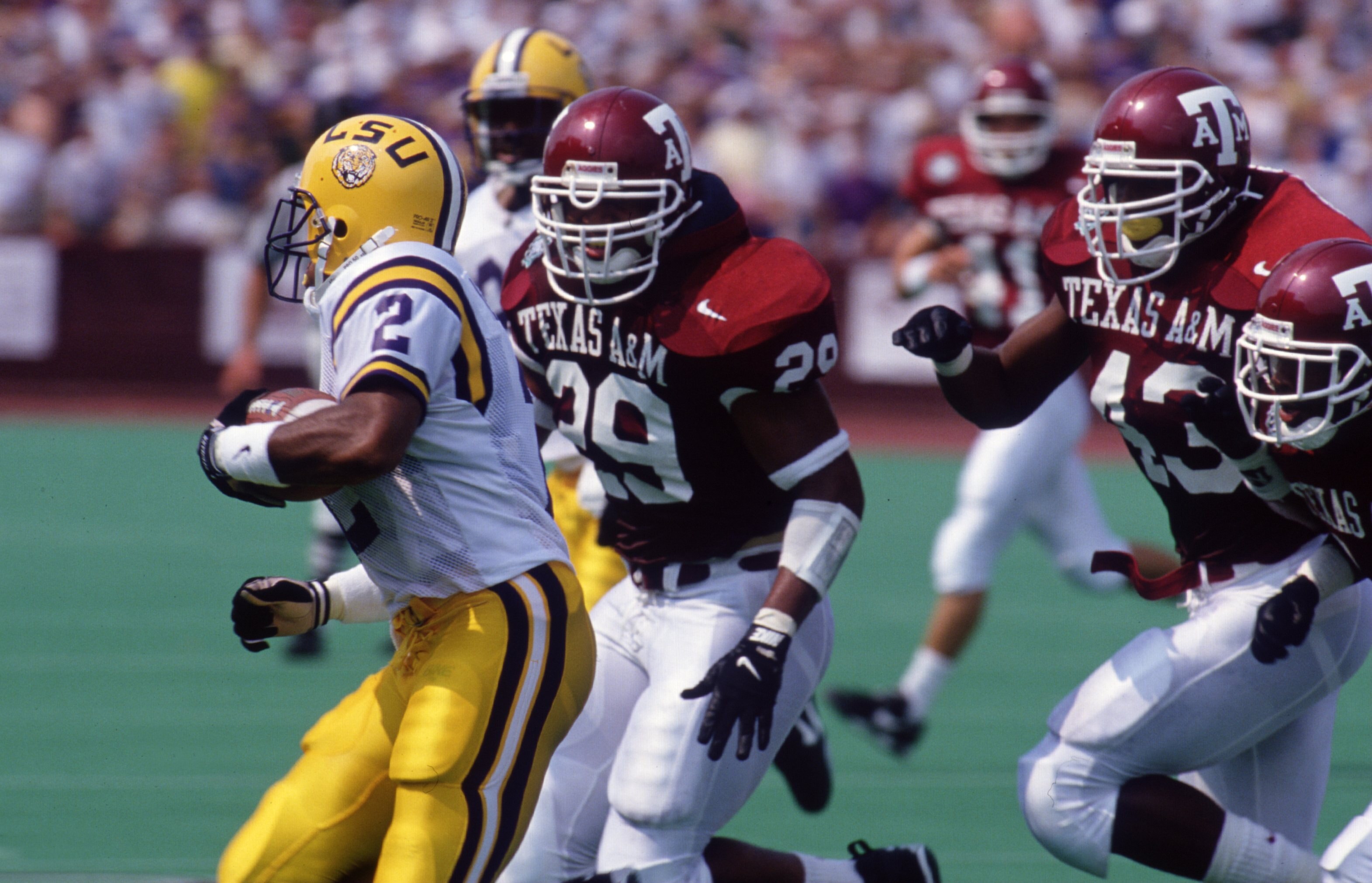 2 Sep 1995: LSU RUNNING BACK EDDIE KENNISON #2 RUNS FROM TEXAS A&M DEFENSIVEMAN GUINTON BROWN #29 DURING THE FIGHTING TIGERS 33-17 LOSS AT KYLE FIELD IN COLLEGE STATION, TEXAS.