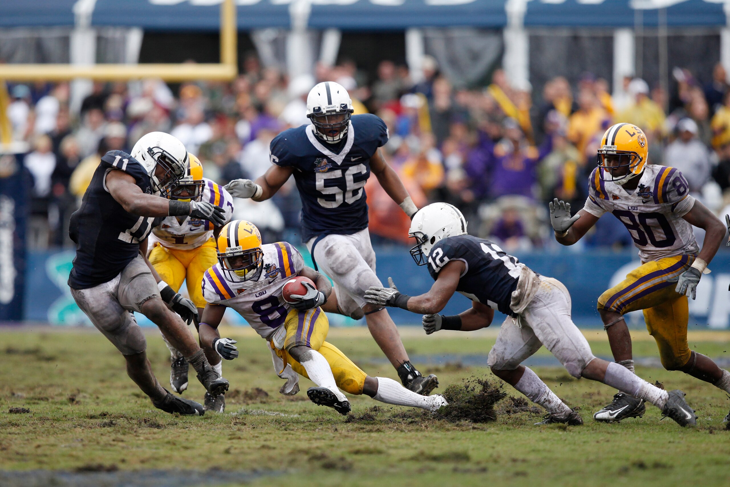 ORLANDO, FL - JANUARY 1: Trindon Holliday #8 of the LSU Tigers slips in the turf between Stephon Morris #12 and Navorro Bowman #11 of the Penn State Nittany Lions during the 2010 Capital One Bowl at the Florida Citrus Bowl Stadium on January 1, 2010 in Or ORLANDO, FL - JANUARY 1: Trindon Holliday #8 of the LSU Tigers slips in the turf between Stephon Morris #12 and Navorro Bowman #11 of the Penn State Nittany Lions during the 2010 Capital One Bowl at the Florida Citrus Bowl Stadium on January 1, 2010 in Or
