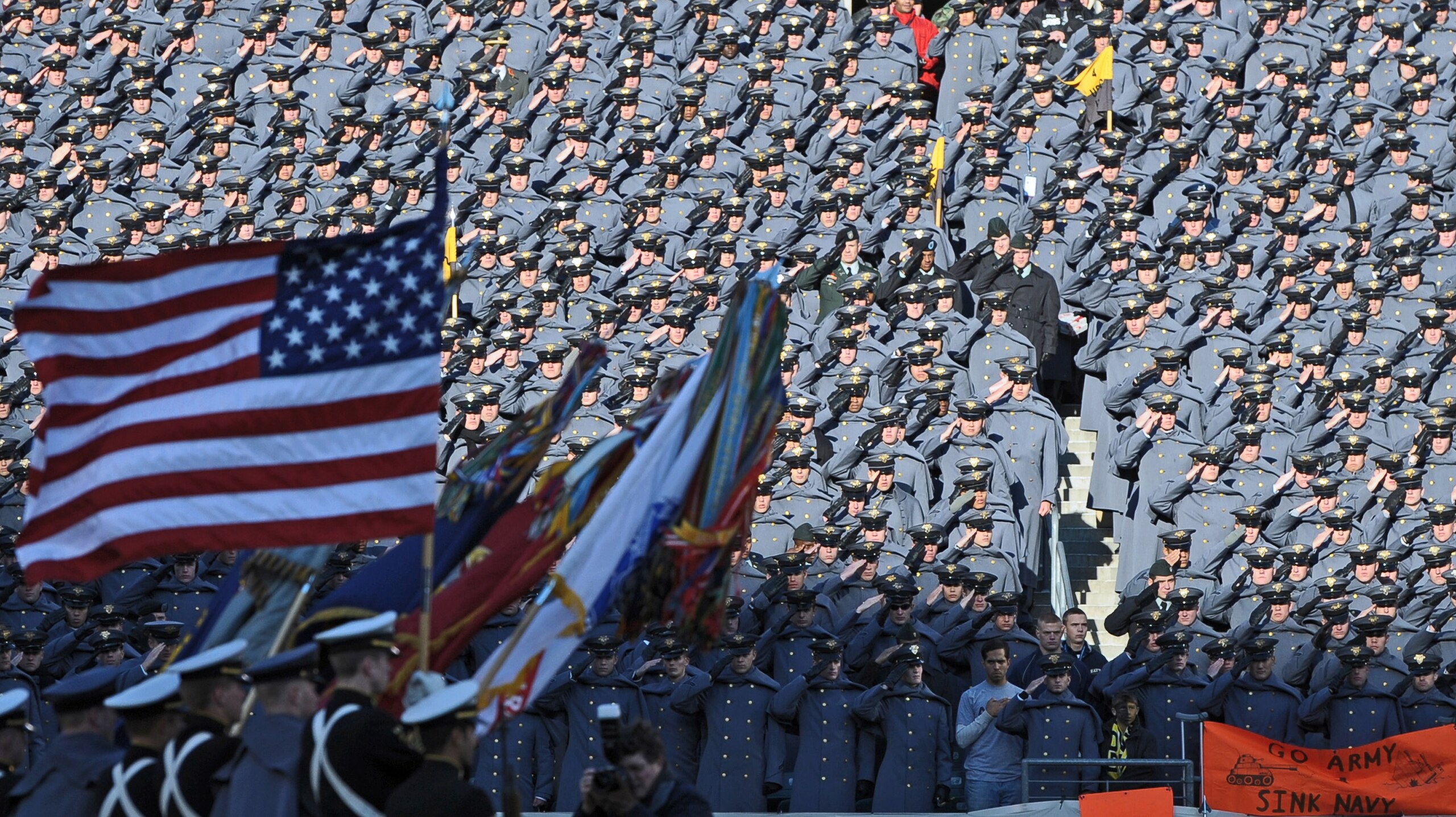 PHILADELPHIA - DECEMBER 12:  Army Cadets salute the American Flag during the National Anthem before the game against the Navy Midshipmen on December 12, 2009 at Lincoln Financial Field in Philadelphia, Pennsylvania. (Photo by Drew Hallowell/Getty Images)