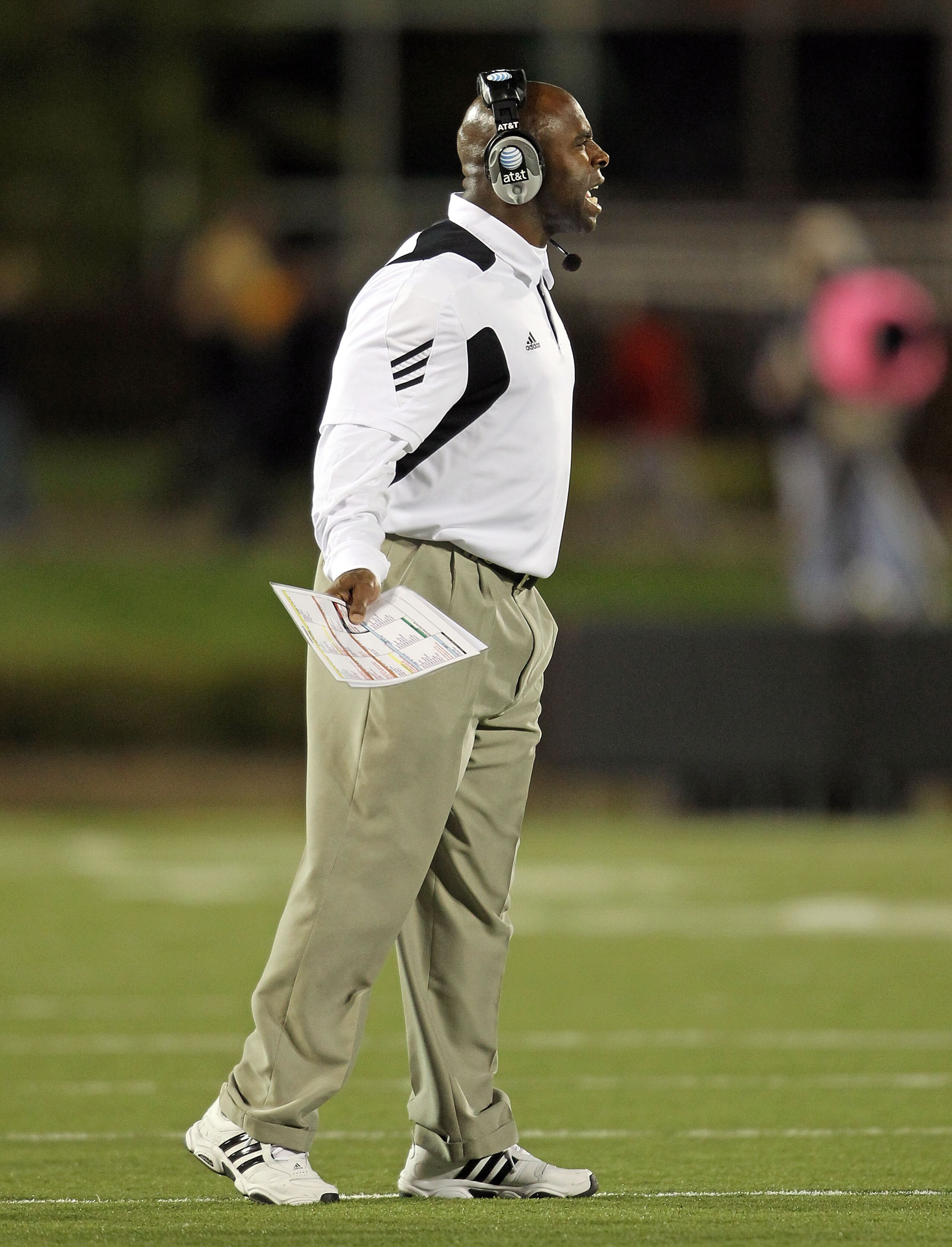 LOUISVILLE, KY - OCTOBER 15: Charlie Strong the Haed Coach of the Louisville Cardinals gives instructions to his team during the Big East Conference game against the Cincinnati Bearcats at Papa John's Cardinal Stadium on October 15, 2010 in Louisville, Ke LOUISVILLE, KY - OCTOBER 15: Charlie Strong the Haed Coach of the Louisville Cardinals gives instructions to his team during the Big East Conference game against the Cincinnati Bearcats at Papa John's Cardinal Stadium on October 15, 2010 in Louisville, Ke