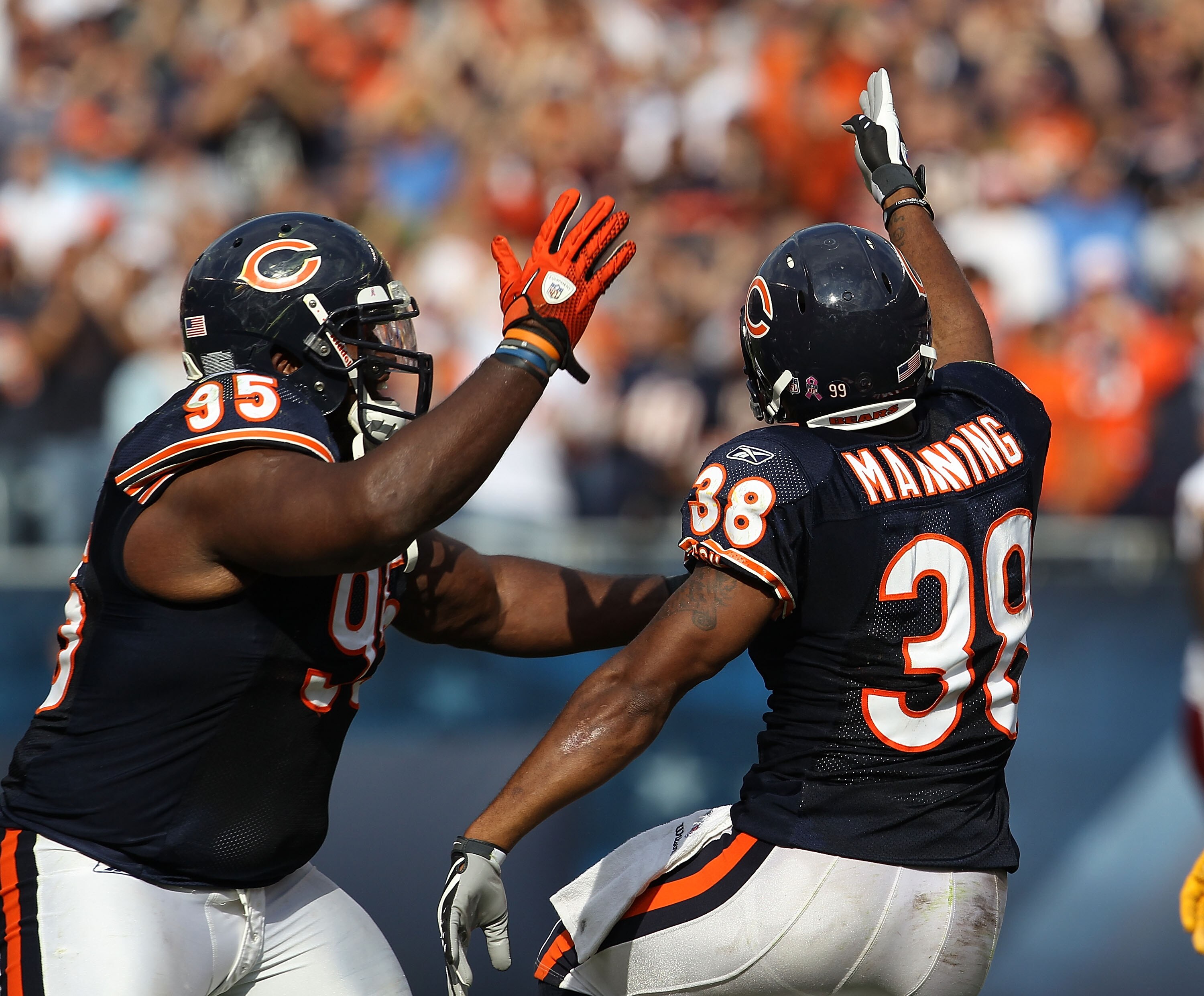CHICAGO - OCTOBER 24: Danieal Manning #38 and Anthony Adams #95 of the Chicago Bears celebrate Mannings' interception against the Washington Redskins at Soldier Field on October 24, 2010 in Chicago, Illinois. The Redskins defeated the Bears 17-14. (Photo
