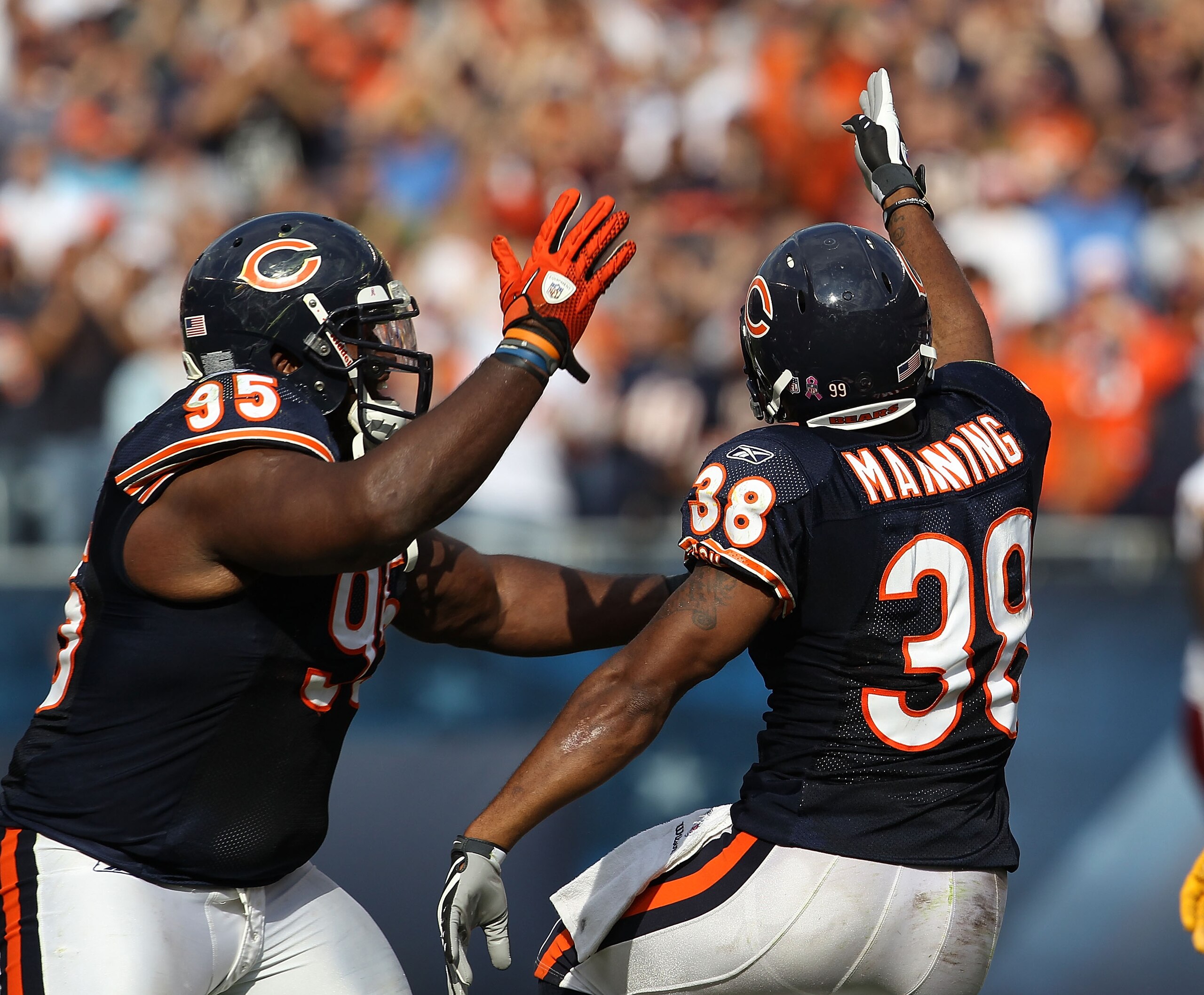 CHICAGO - OCTOBER 24: Danieal Manning #38 and Anthony Adams #95 of the Chicago Bears celebrate Mannings' interception against the Washington Redskins at Soldier Field on October 24, 2010 in Chicago, Illinois. The Redskins defeated the Bears 17-14. (Photo