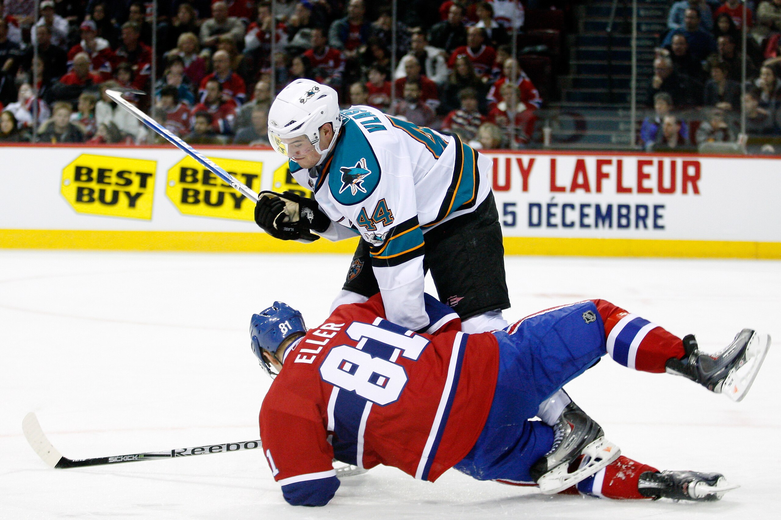 MONTREAL- DECEMBER 4:  Marc-Edouard Vlasic #44 of the San Jose Sharks body checks Lars Eller #81 of the Montreal Canadiens during the NHL game at the Bell Centre on December 4, 2010 in Montreal, Quebec, Canada.  The Canadiens defeated the Sharks 3-1.  (Ph
