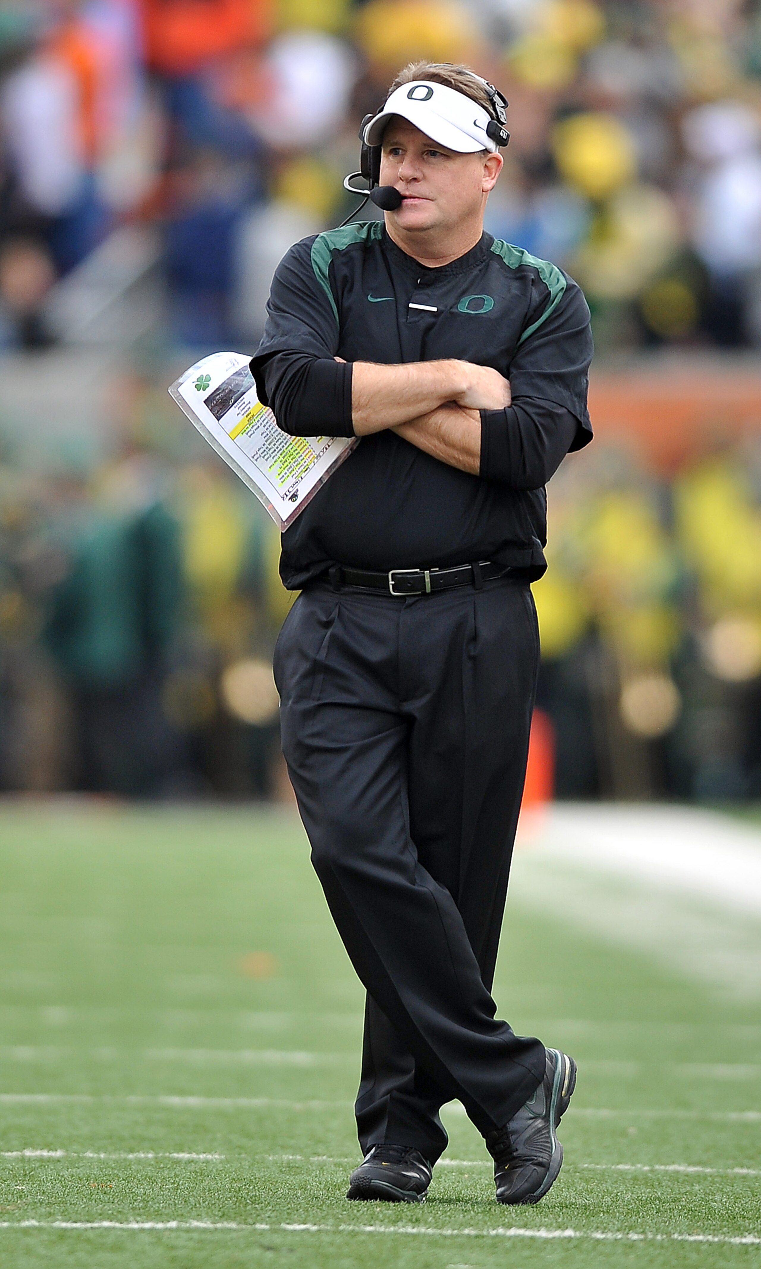CORVALLIS, OR - DECEMBER 4: Head coach Chip Kelly of the Oregon Ducks looks on from the sidelines in the second quarter of the game against the the Oregon State Beavers at Reser Stadium on December 4, 2010 in Corvallis, Oregon. The Ducks beat the Beavers