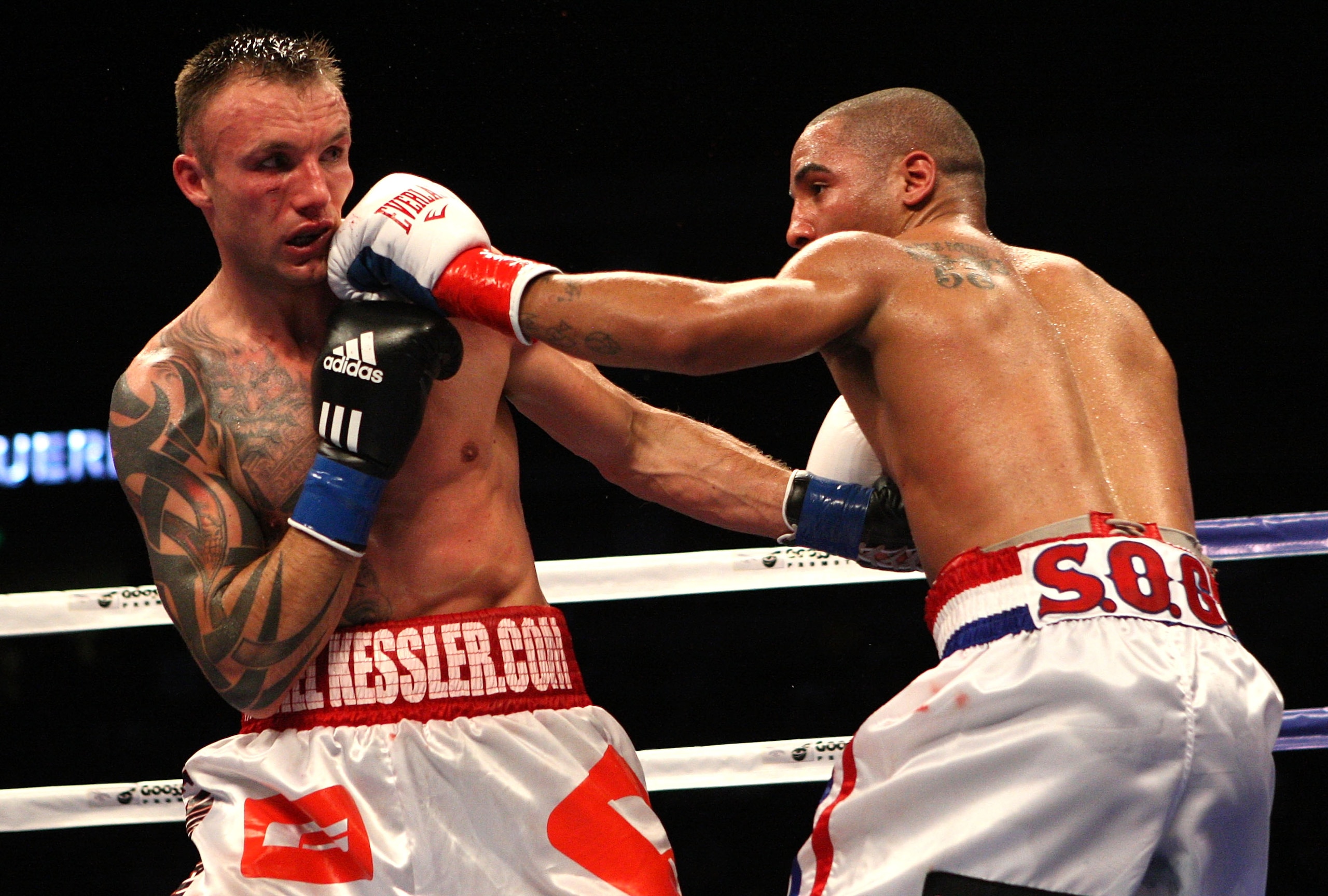 OAKLAND, CA - NOVEMBER 21:  Mikkel Kessler of Denmark (L) is hit by Andre Ward during their WBA Super Middleweight Championship Bout at the Oakland-Alameda County Coliseum on November 21, 2009 in Oakland, California.  (Photo by Jed Jacobsohn/Getty Images)