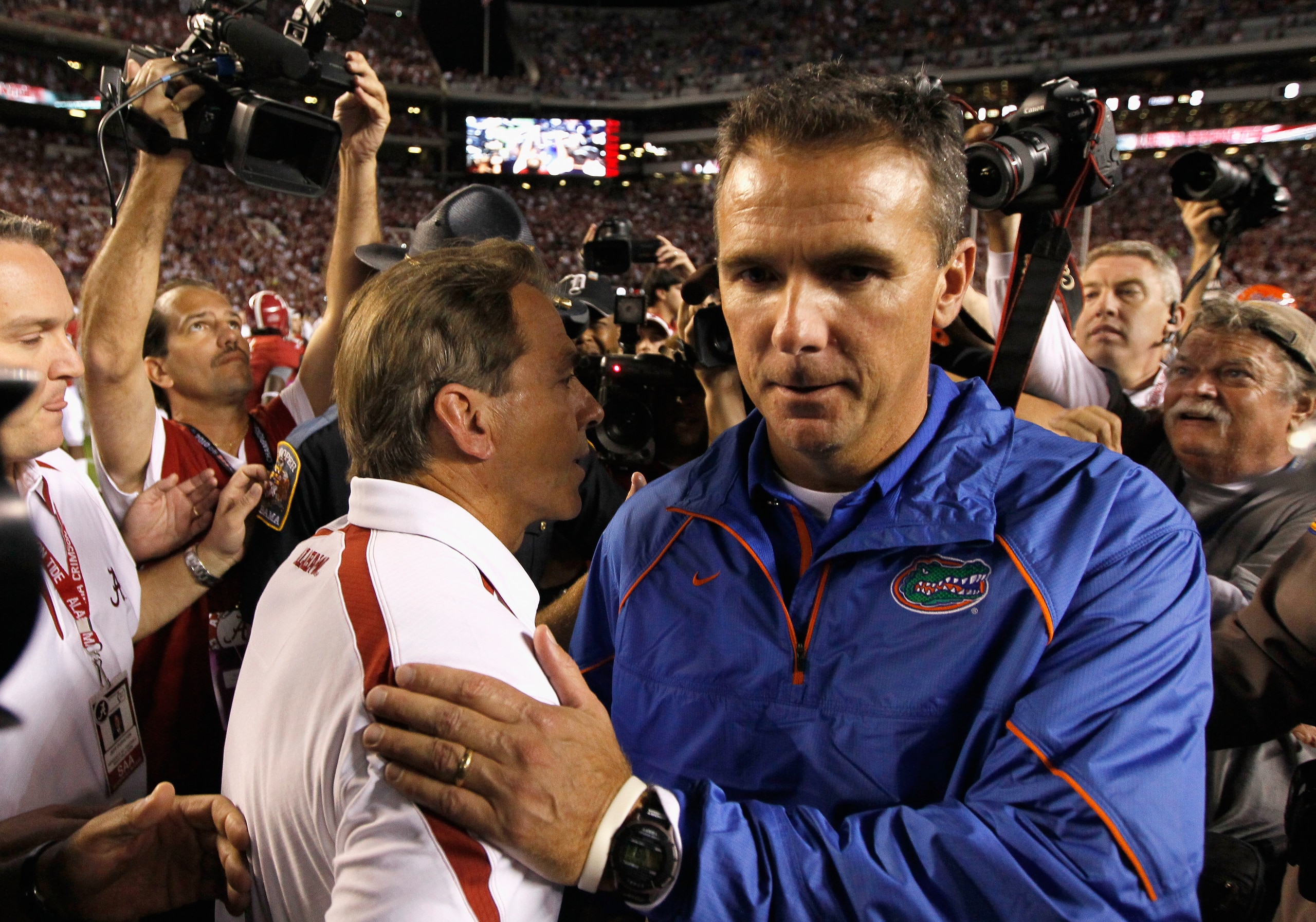 TUSCALOOSA, AL - OCTOBER 02:  Head coach Nick Saban of the Alabama Crimson Tide shakes hands with head coach Urban Meyer of the Florida Gators after the Crimson Tide's 31-6 win at Bryant-Denny Stadium on October 2, 2010 in Tuscaloosa, Alabama.  (Photo by