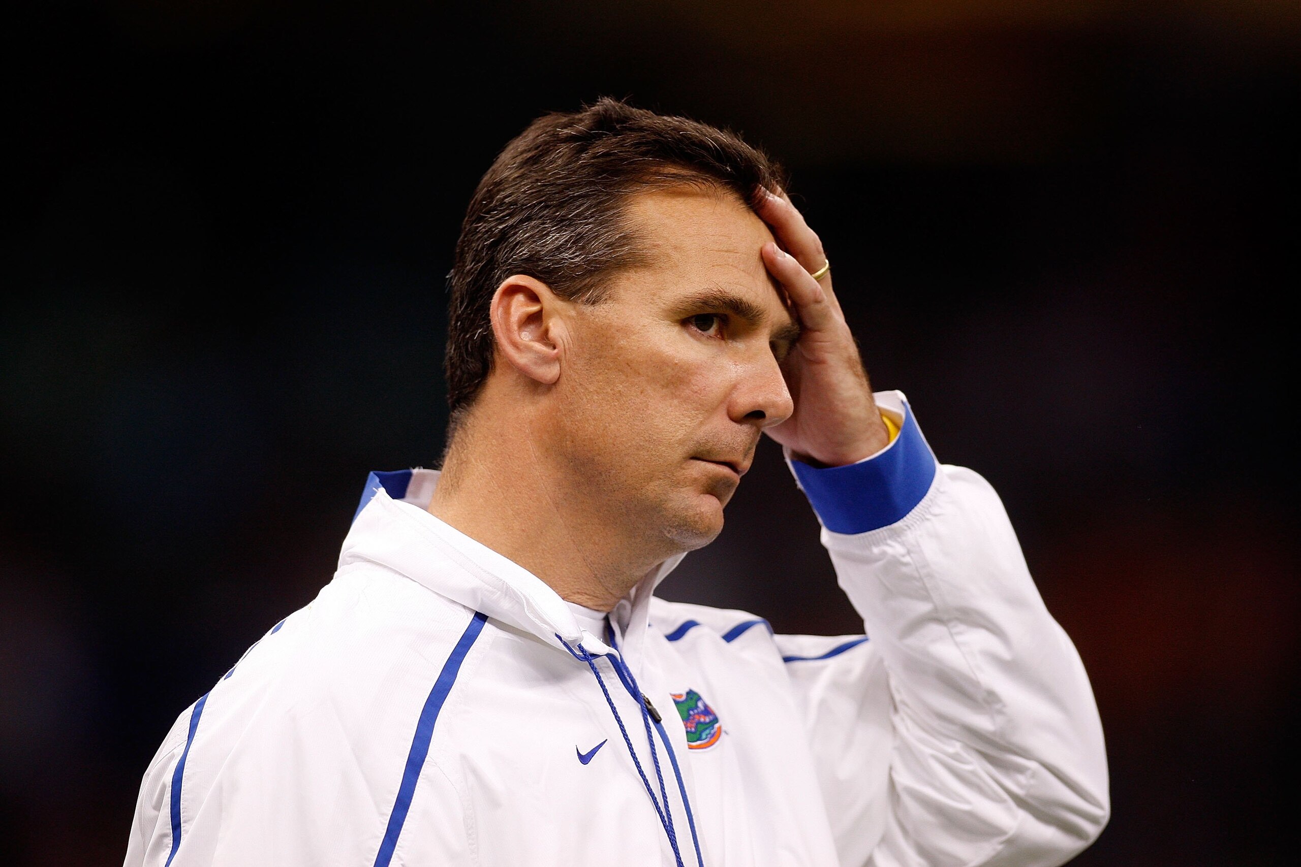 NEW ORLEANS - JANUARY 01:  Head coach Urban Meyer of the Florida Gators watches his team warm up before playing the Cincinnati Bearcats during the Allstate Sugar Bowl at the Louisana Superdome on January 1, 2010 in New Orleans, Louisiana.  (Photo by Chris