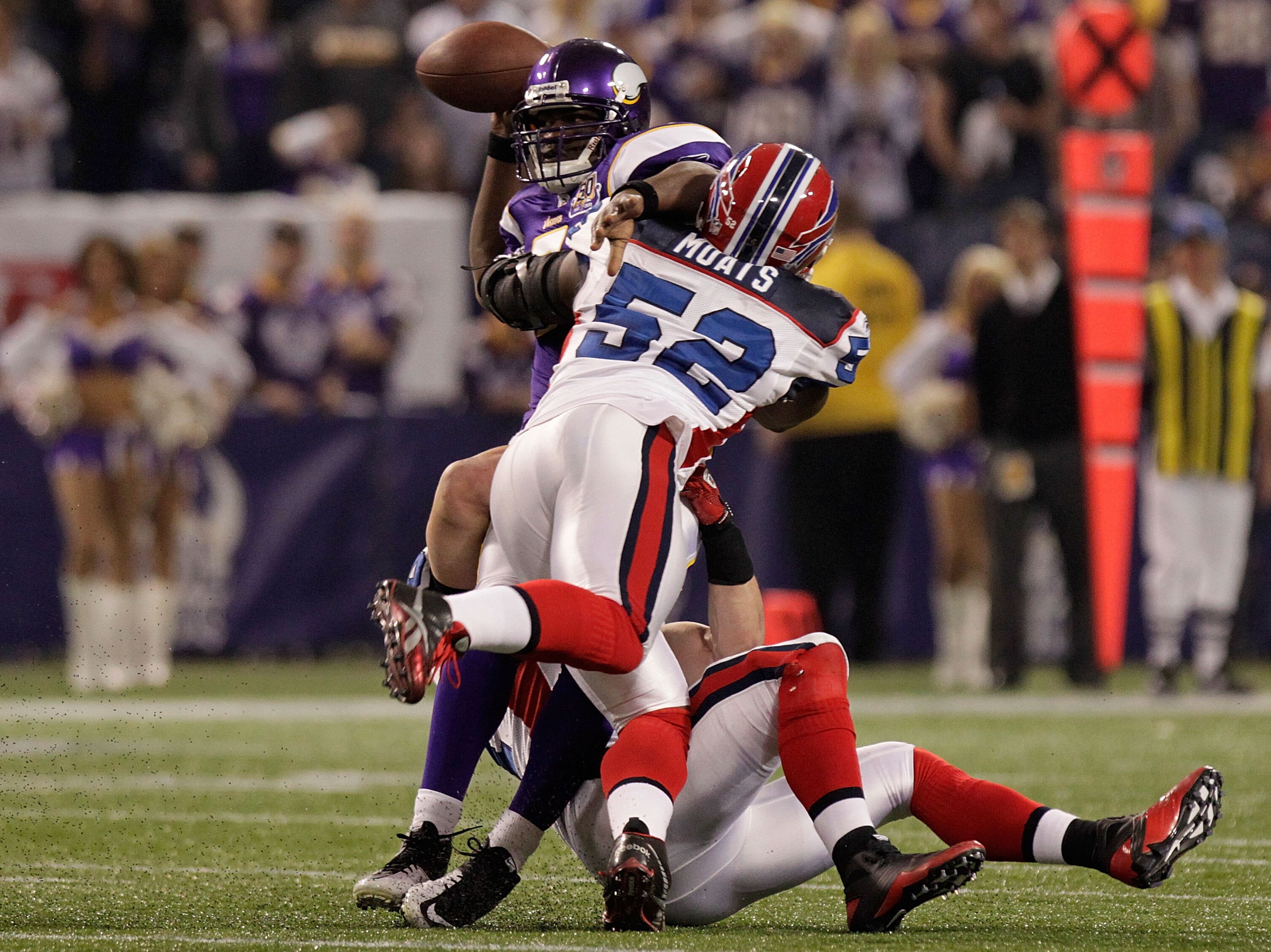 MINNEAPOLIS, MN - DECEMBER 05: Tavaris Jackson #7 of the Minnesota Vikings is sacked by Paul Posluszny #51 and Arthur Moats #52 of the Buffalo Bills at the Mall of America Field at the Hubert H. Humphrey Metrodome on December 5, 2010 in Minneapolis, Minne