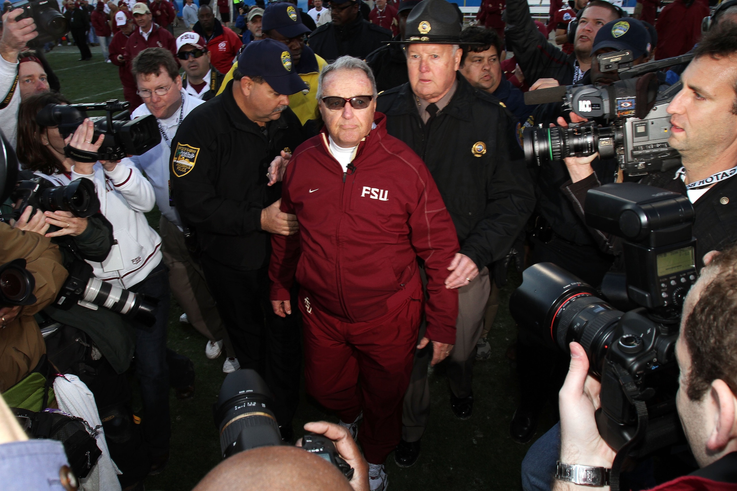 JACKSONVILLE, FL - JANUARY 01:  Head coach Bobby Bowden of the Florida State Seminoles is escorted off the field after defeating the West Virginia Mountaineers during the Konica Minolta Gator Bowl on January 1, 2010 at Jacksonville Municipal Stadium in Ja