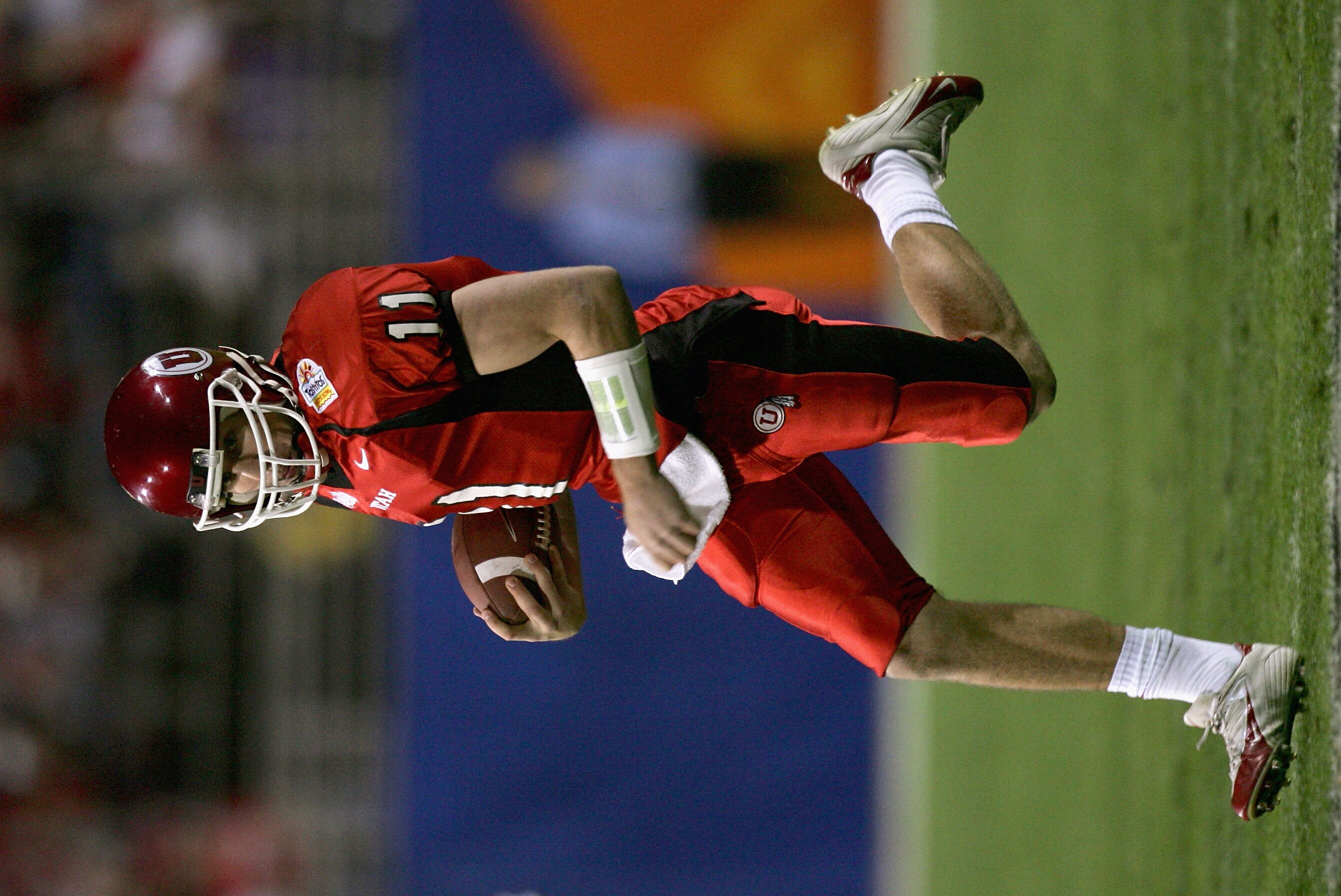 TEMPE, AZ - JANUARY 1:  Quarterback Alex Smith of Utah runs with the ball in the first quarter against Pittsburgh in the Tostito's Fiesta Bowl at the Sun Devil Stadium on January 1, 2005 in Tempe, Arizona. (Photo by Harry How/Getty Images).