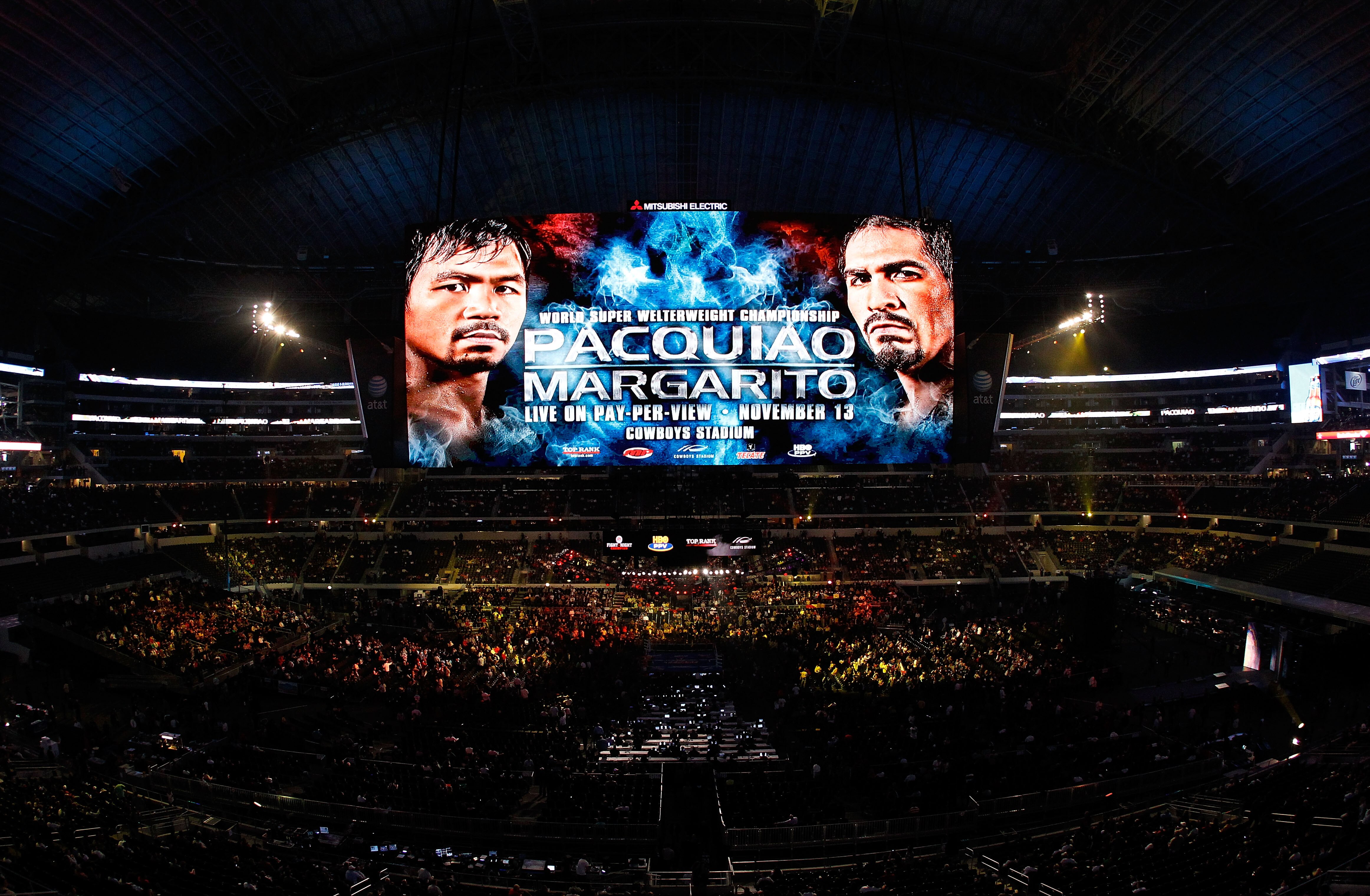 ARLINGTON, TX - NOVEMBER 13:  The giant video screen displays the main event title bout match up between Manny Pacquiao (L) of the Philippines and Antonio Margarito of Mexico prior to their WBC World Super Welterweight Title bout at Cowboys Stadium on Nov