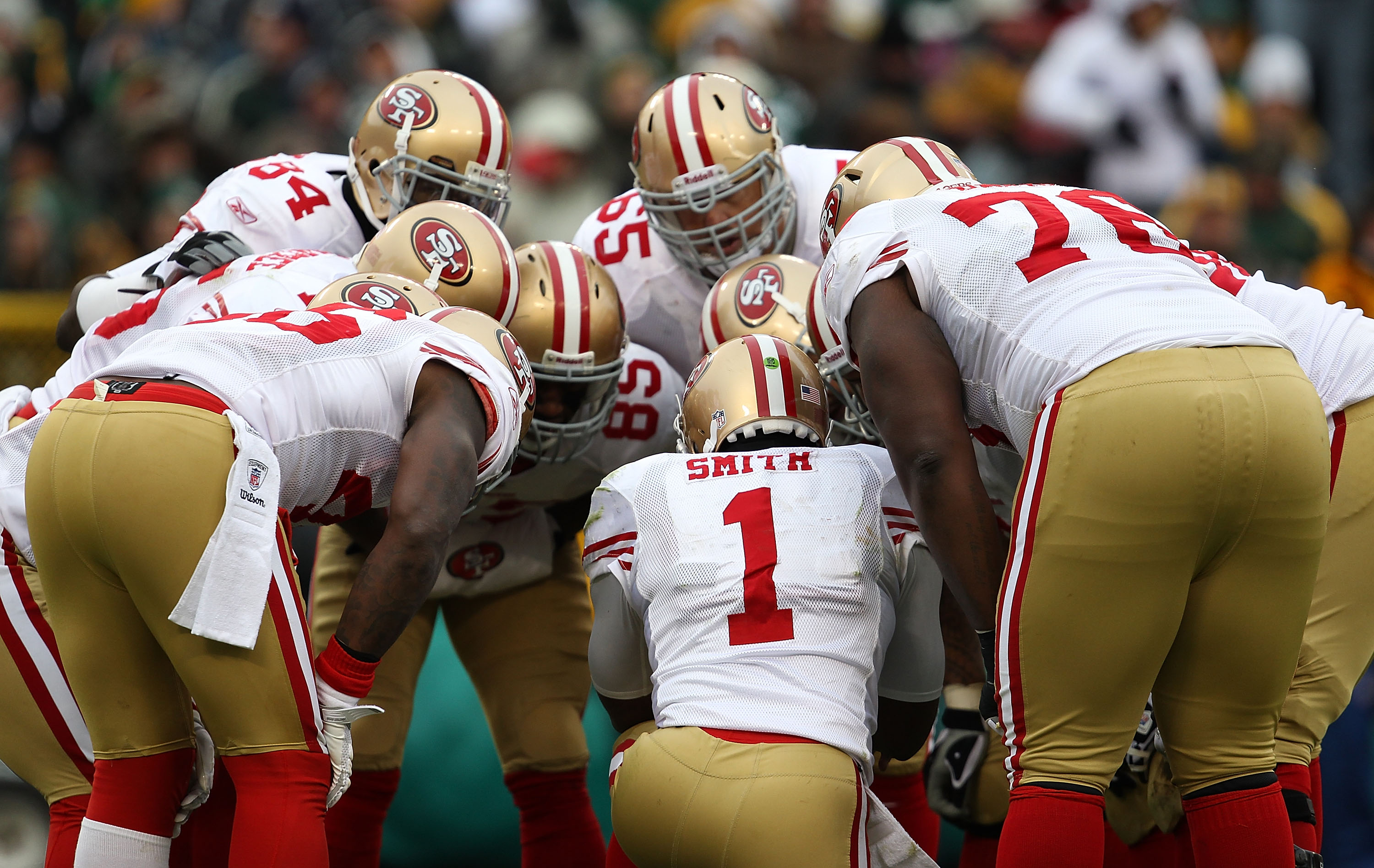 GREEN BAY, WI - DECEMBER 05: Troy Smith #1 of the San Francisco 49ers calls a play in the huddle against the Green Bay Packers at Lambeau Field on December 5, 2010 in Green Bay, Wisconsin. The Packers defeated the 49ers 34-16. (Photo by Jonathan Daniel/Ge