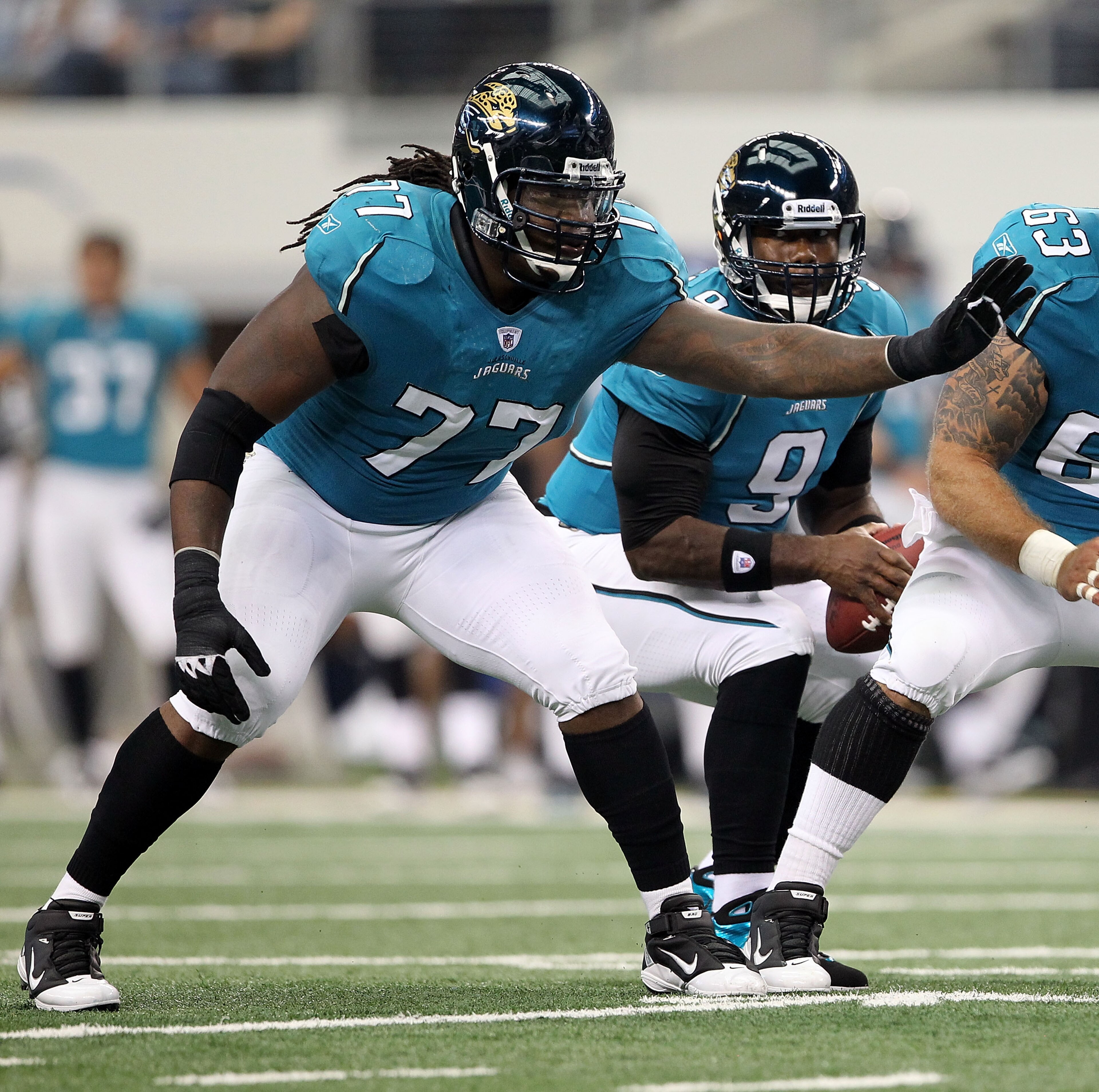 ARLINGTON, TX - OCTOBER 31:  Offensive guard Uche Nwaneri #77 of the Jacksonville Jaguars blocks against the Dallas Cowboys at Cowboys Stadium on October 31, 2010 in Arlington, Texas.  (Photo by Chris Chambers/Getty Images)