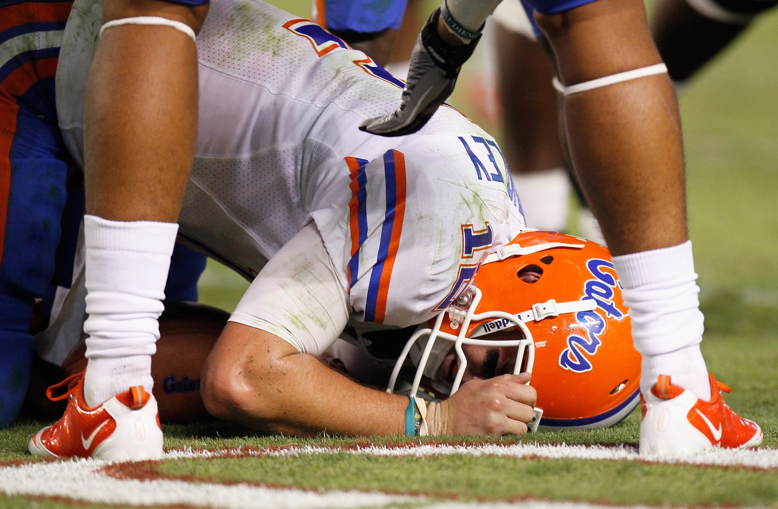TUSCALOOSA, AL - OCTOBER 02:  Quarterback John Brantley #12 of the Florida Gators is attended to by trainers against the Alabama Crimson Tide at Bryant-Denny Stadium on October 2, 2010 in Tuscaloosa, Alabama.  (Photo by Kevin C. Cox/Getty Images)