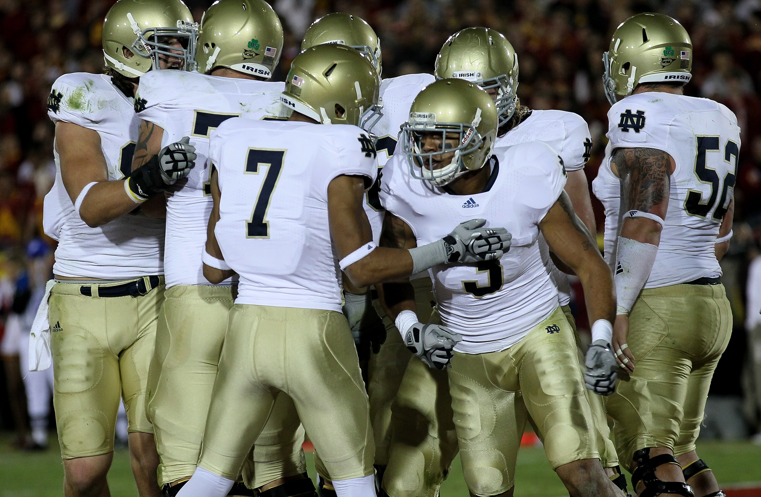 LOS ANGELES - NOVEMBER 27: Wide receiver Michael Floyd #3 of the Notre Dame Fighting Irish celebrates with wide receiver T.J. Jones #7 after making a one yard touchdown catch against the USC Trojans at the Los Angeles Memorial Coliseum on November 27, 20 LOS ANGELES - NOVEMBER 27: Wide receiver Michael Floyd #3 of the Notre Dame Fighting Irish celebrates with wide receiver T.J. Jones #7 after making a one yard touchdown catch against the USC Trojans at the Los Angeles Memorial Coliseum on November 27, 20