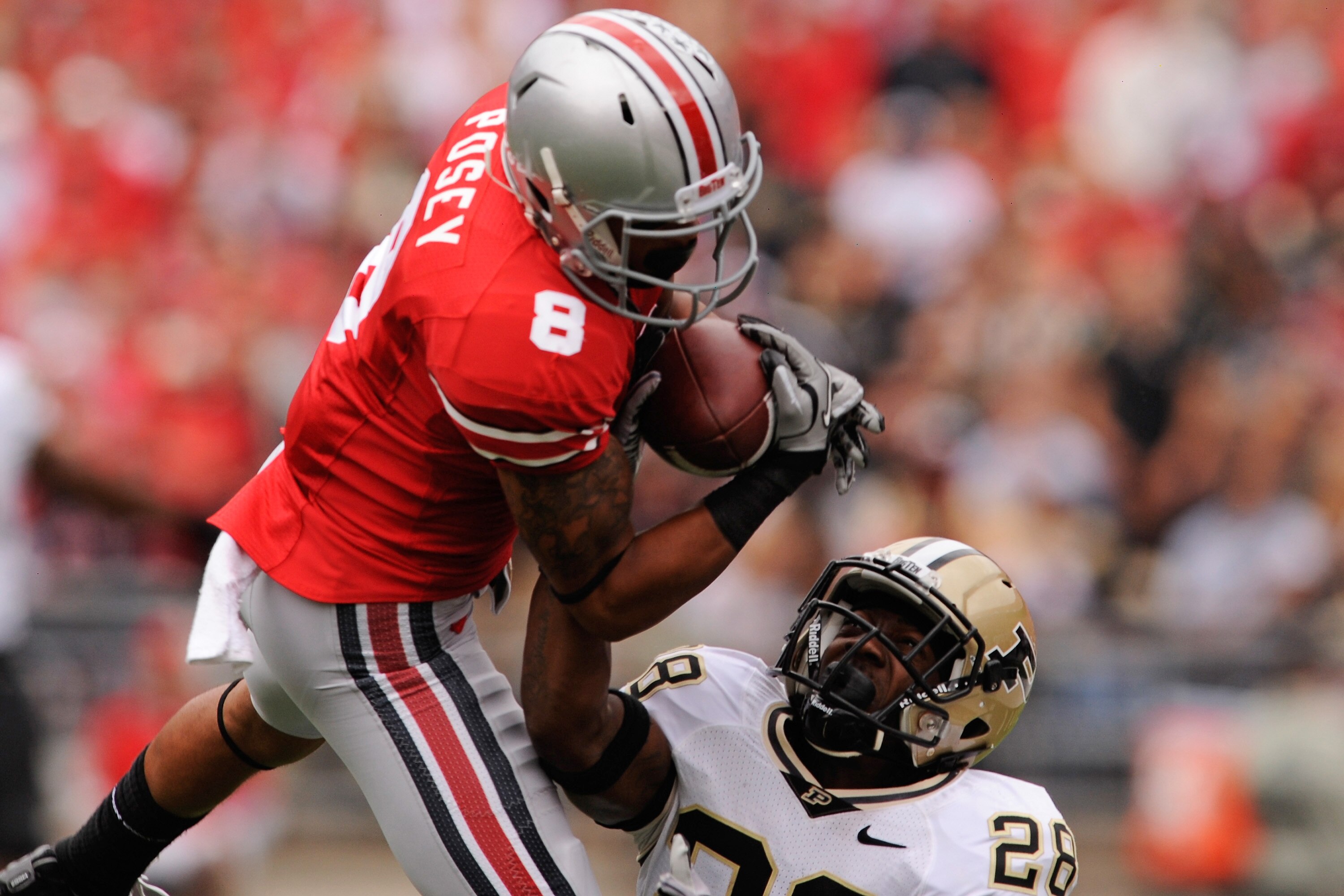 COLUMBUS, OH - OCTOBER 23:  Josh Johnson #28 of the Purdue Boilermakers breaks up a pass intended for DeVier Posey #8 of the Ohio State Buckeyes at Ohio Stadium on October 23, 2010 in Columbus, Ohio.  (Photo by Jamie Sabau/Getty Images)