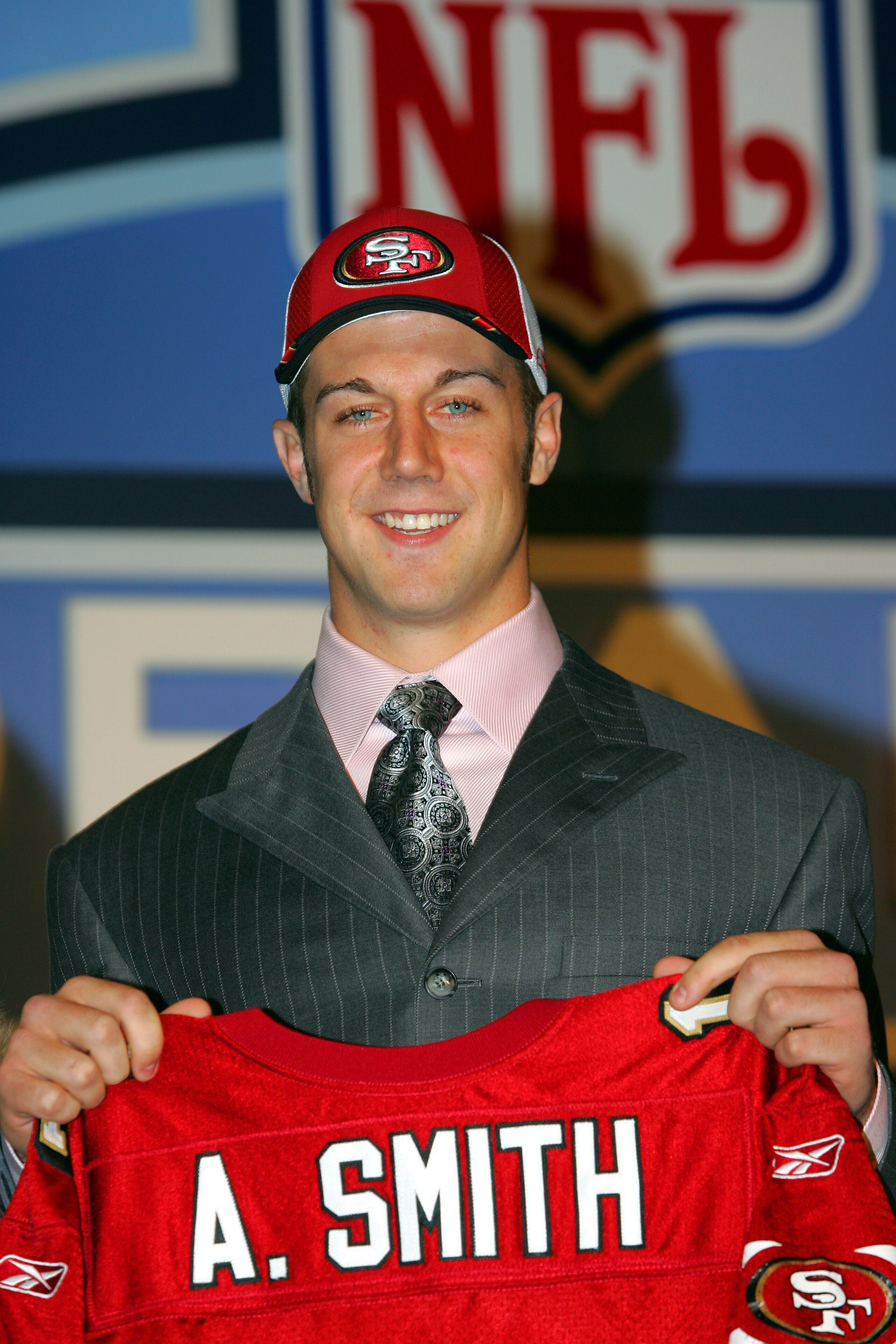 NEW YORK CITY - APRIL 23:  Quarterback Alex Smith (Utah) poses with his jersey during the 70th NFL Draft on April 23, 2005 at the Jacob K. Javits Convention Center in New York City. Smith was drafted first overall by the San Francisco 49ers.  (Photo by Ch