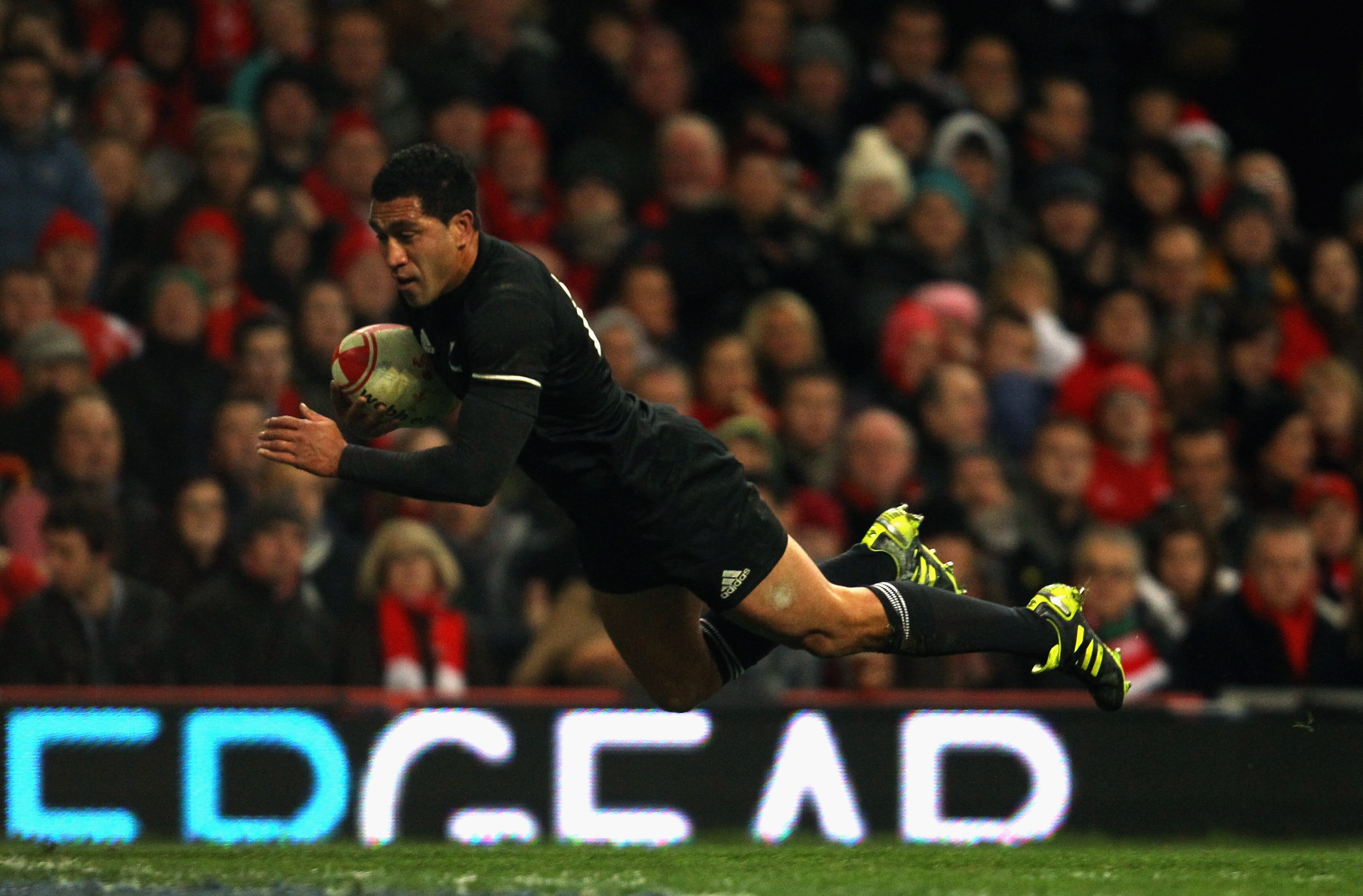 CARDIFF, WALES - NOVEMBER 27: Mils Muliaina of the All Blacks scores a try during the Test match between Wales and the New Zealand All Blacks at Millennium Stadium on November 27, 2010 in Cardiff, Wales.  (Photo by Phil Walter/Getty Images)