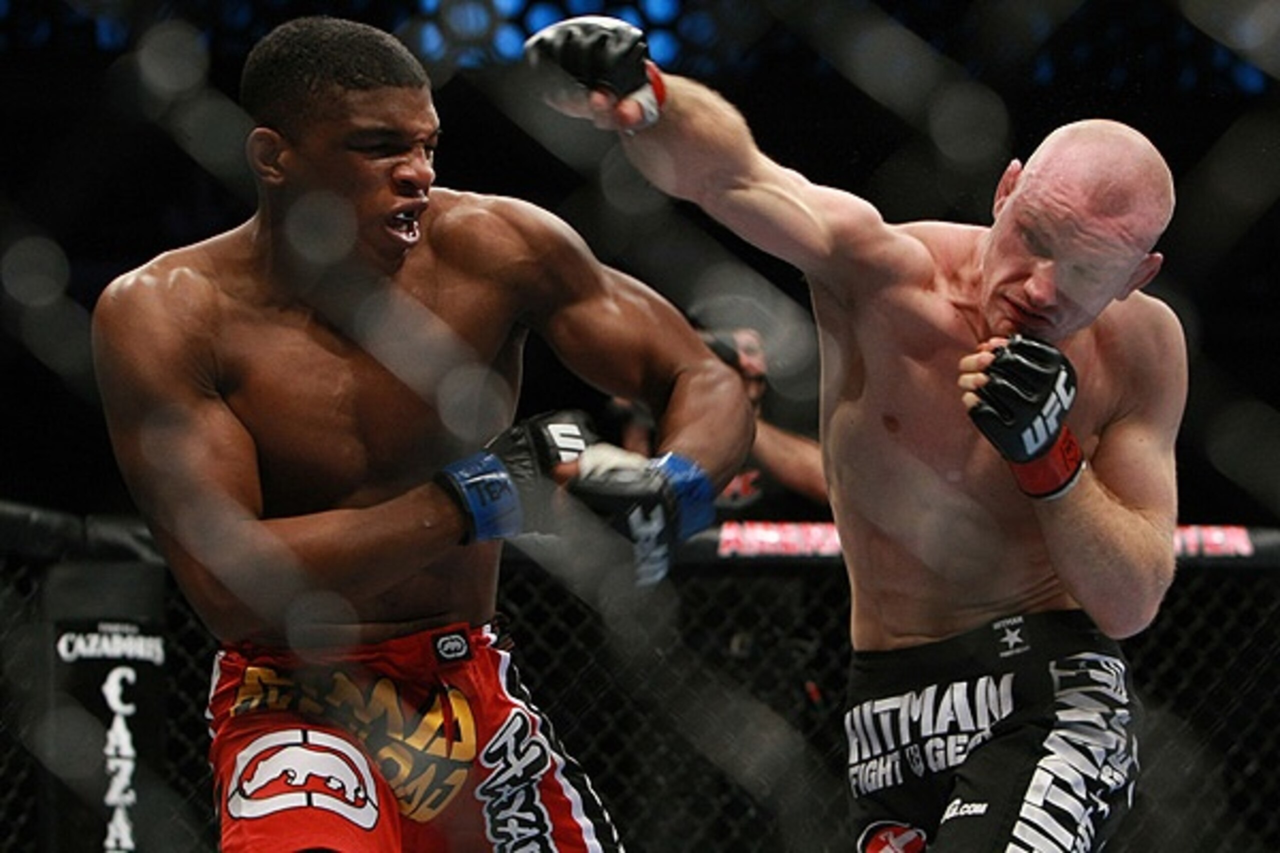 Martin Kampmann delivering an overhand right to Paul Daley
