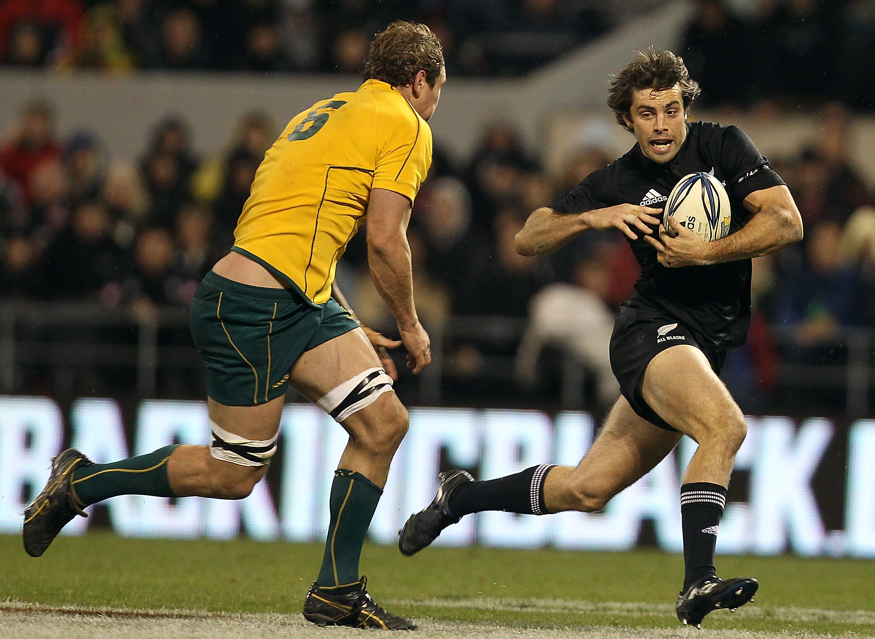 CHRISTCHURCH, NEW ZEALAND - AUGUST 07: Conrad Smith of the All Blacks attacks past Rocky Elsom of the Wallabies during the 2010 Tri-Nations Bledisloe Cup match between the Australian Wallabies and the New Zealand All Blacks at AMI Stadium on August 7, 201