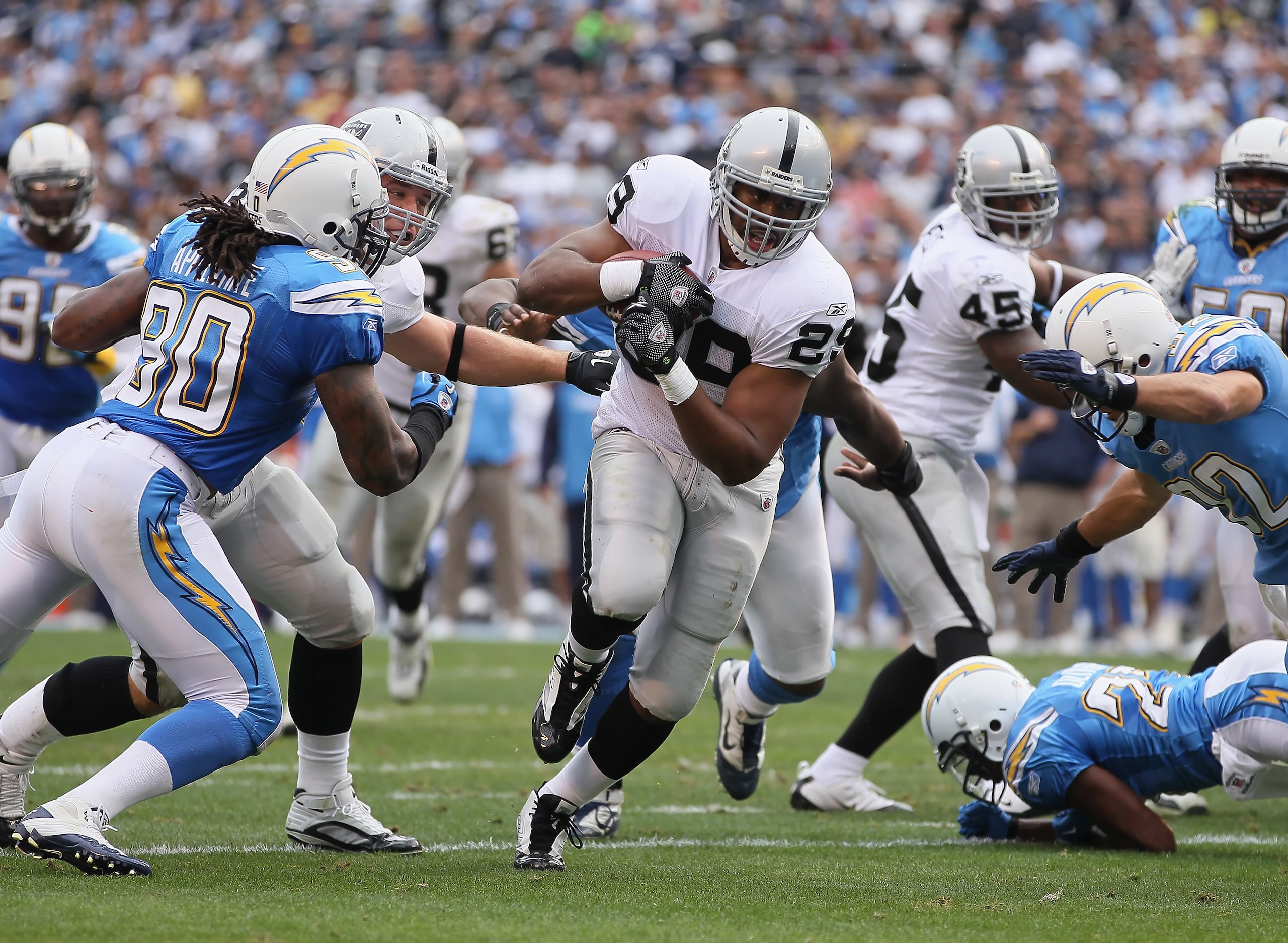 SAN DIEGO - DECEMBER 05:  Running back Michael Bush #29 of the Oakland Raiders carries the ball for a touchdown in the second quarter against the San Diego Chargers at Qualcomm Stadium on December 5, 2010 in San Diego, California. The Raiders defeated the