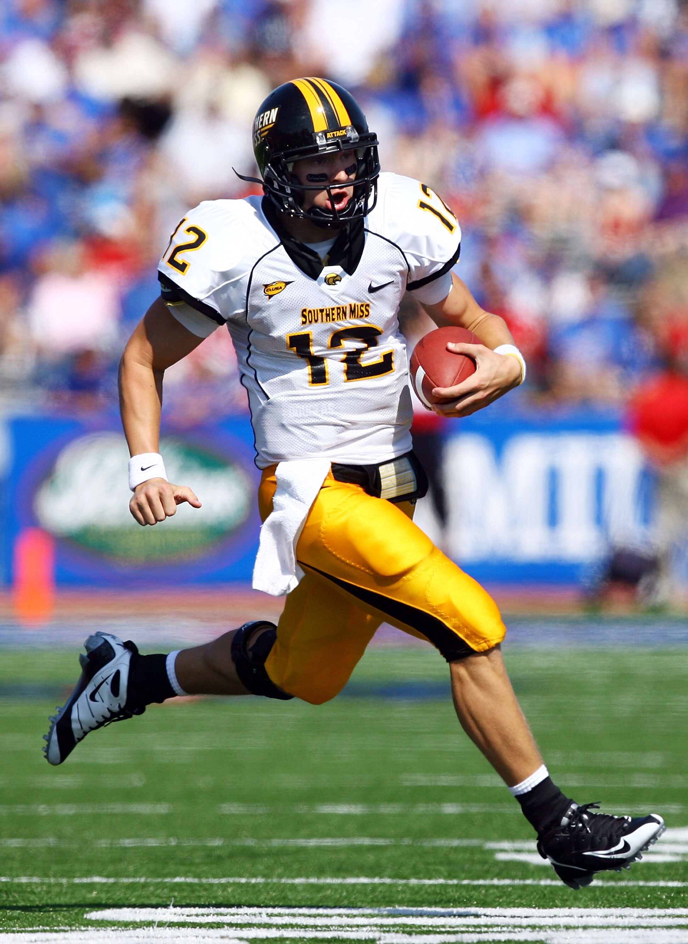 LAWRENCE, KS - SEPTEMBER 26:  Quarterback Austin Davis #12 of the Southern Mississippi Golden Eagles scrambles during the game against the Kansas Jayhawks on September 26, 2009 at Memorial Stadium in Lawrence, Kansas.  (Photo by Jamie Squire/Getty Images)