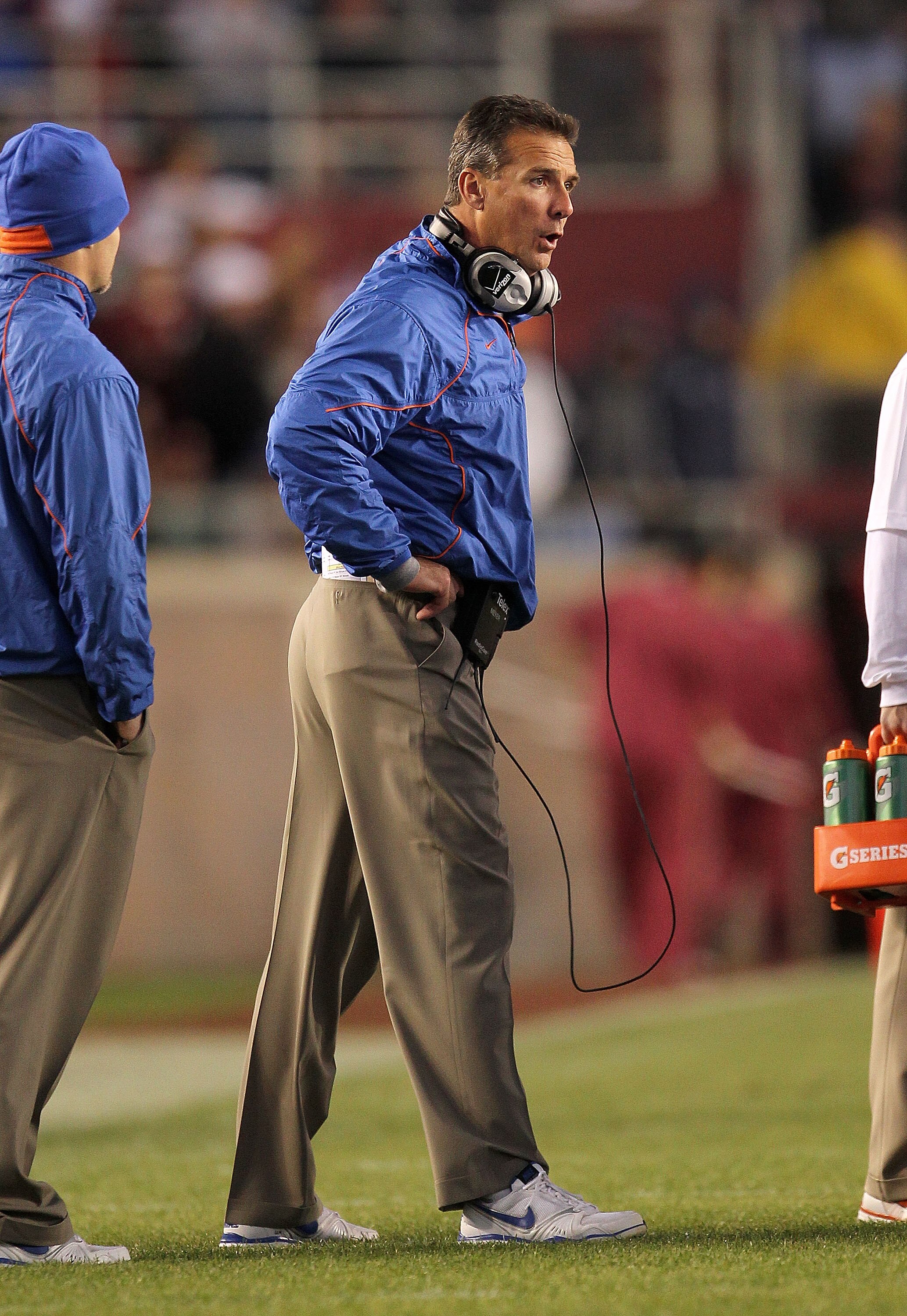 TALLAHASSEE, FL - NOVEMBER 27:  Florida Gators head coach Urban Meyer talks with players during a timeout during a game against the Florida State Seminoles at Doak Campbell Stadium on November 27, 2010 in Tallahassee, Florida.  (Photo by Mike Ehrmann/Gett