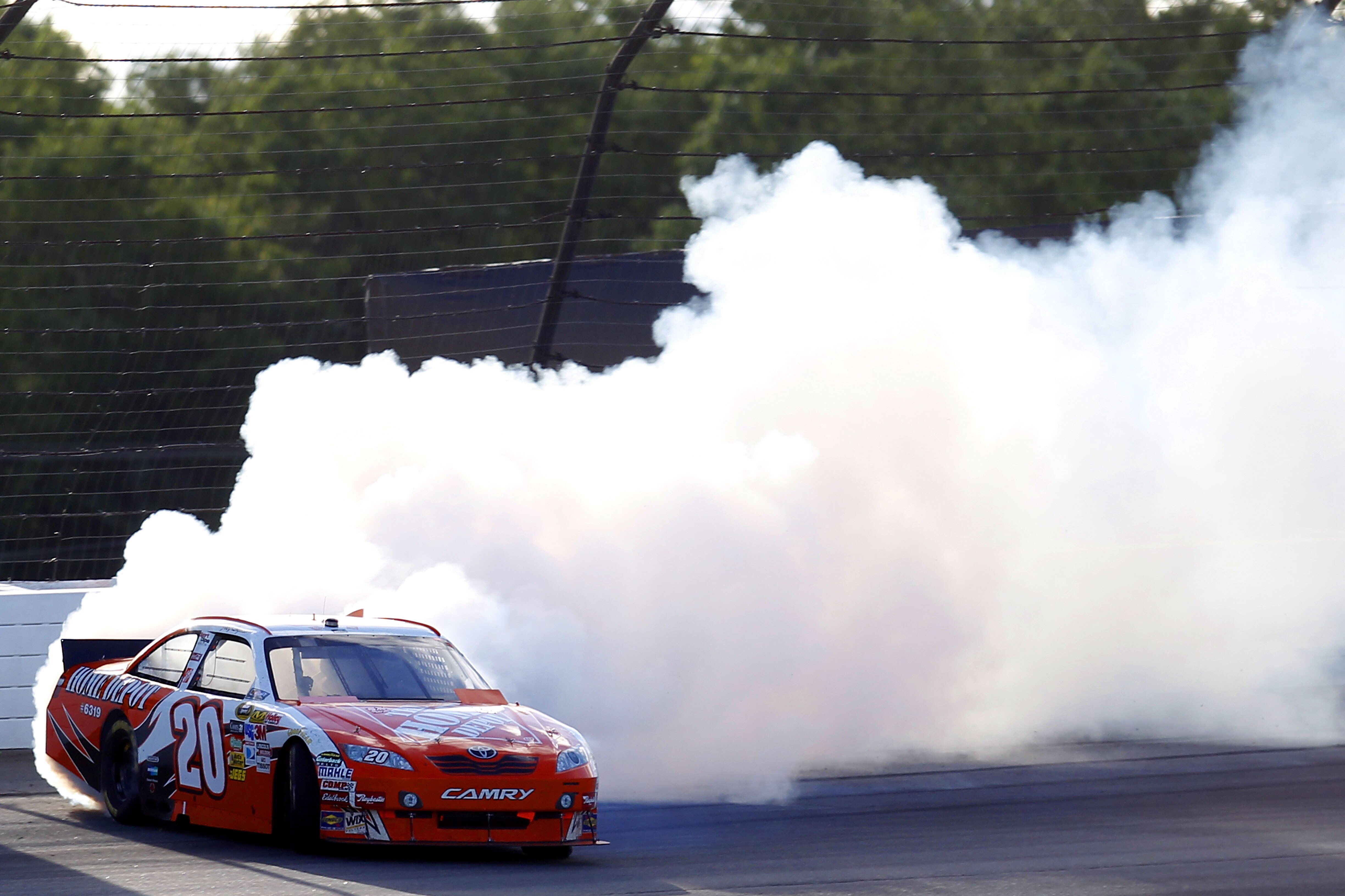 LONG POND, PA - JUNE 06:  Joey Logano, driver of the #20 Home Depot Toyota, hits the wall after an incident with Kevin Harvick, driver of the #29 Shell/Pennzoil Chevrolet, during the NASCAR Sprint Cup Series Gillette Fusion ProGlide 500 at Pocono Raceway