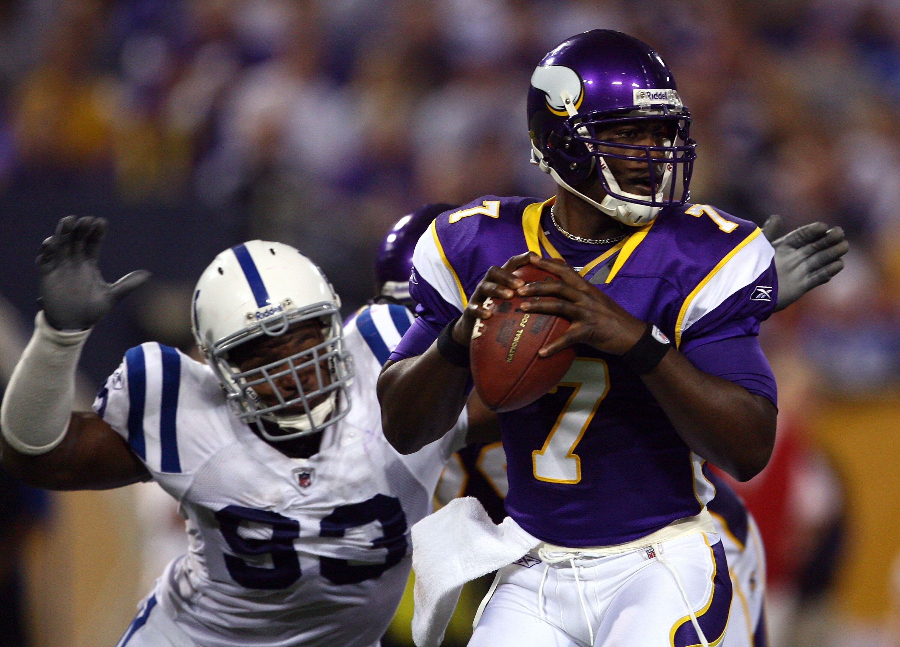 MINNEAPOLIS - SEPTEMBER 14:  Quarterback Tavaris Jackson #7 of the Minnesota Vikings drops back to pass before being sacked by Dwight Freeney #93 of the Indianapolis Colts in the third quarter at the Metrodome on September 14, 2008 in Minneapolis, Minneso